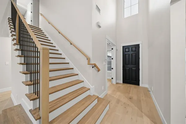 a view of entryway with wooden floor
