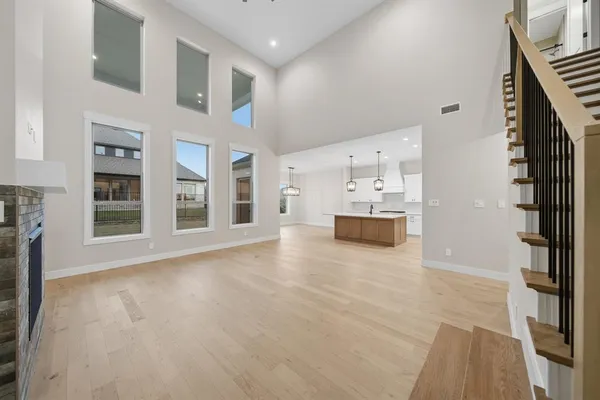 a view of a kitchen with furniture and an empty room