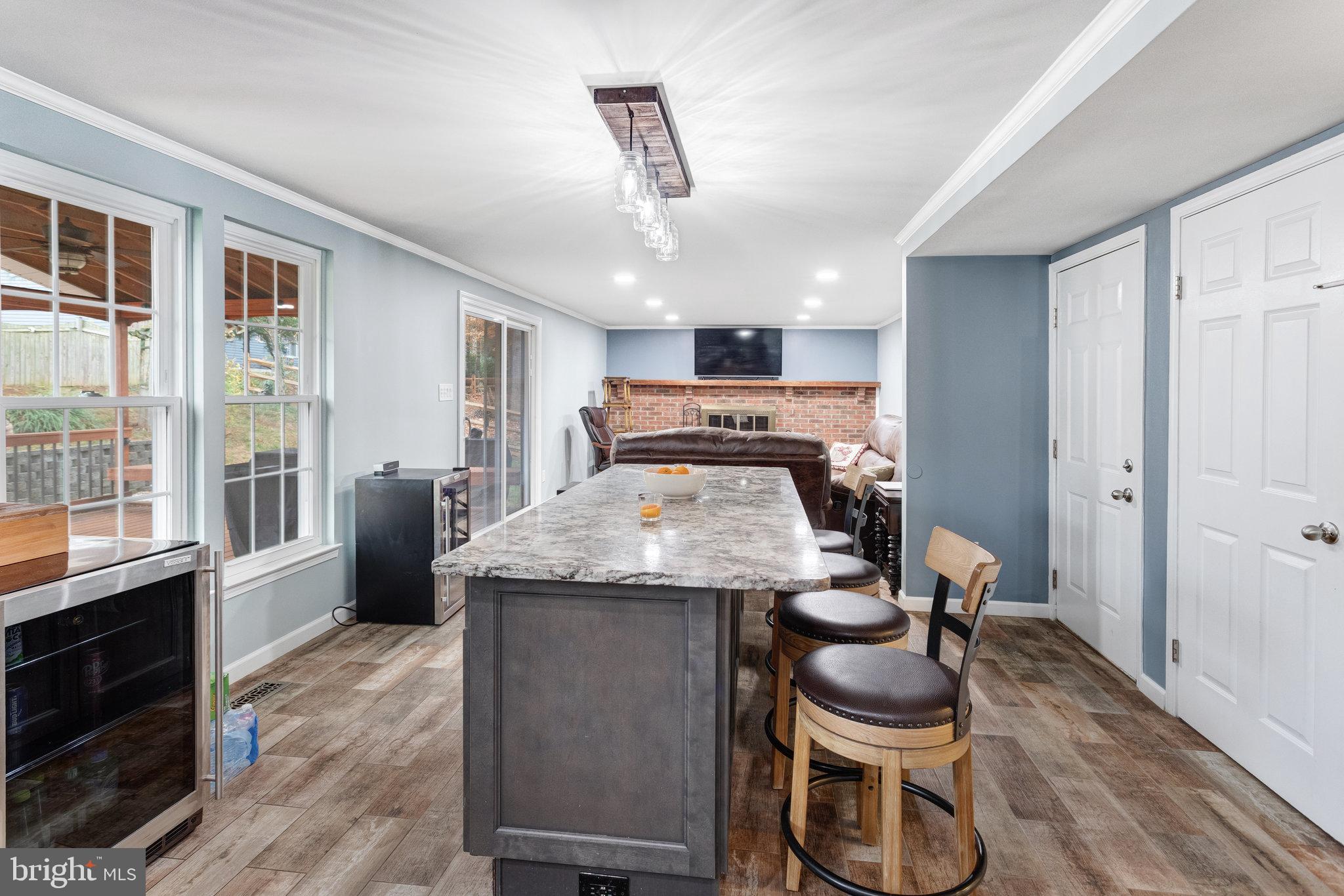 4586 Rincon Place Dumfries, VA 22025 - Photo 13 of 46 a kitchen with stainless steel appliances granite countertop a stove and a refrigerator