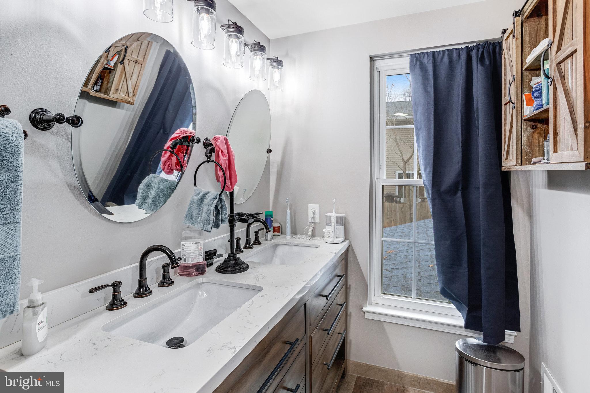 4586 Rincon Place Dumfries, VA 22025 - Photo 23 of 46 a bathroom with a sink and a mirror