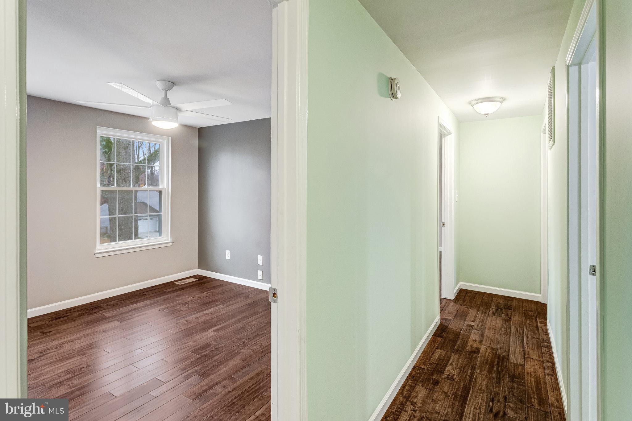 4586 Rincon Place Dumfries, VA 22025 - Photo 25 of 46 a view of hallway with window and wooden floor