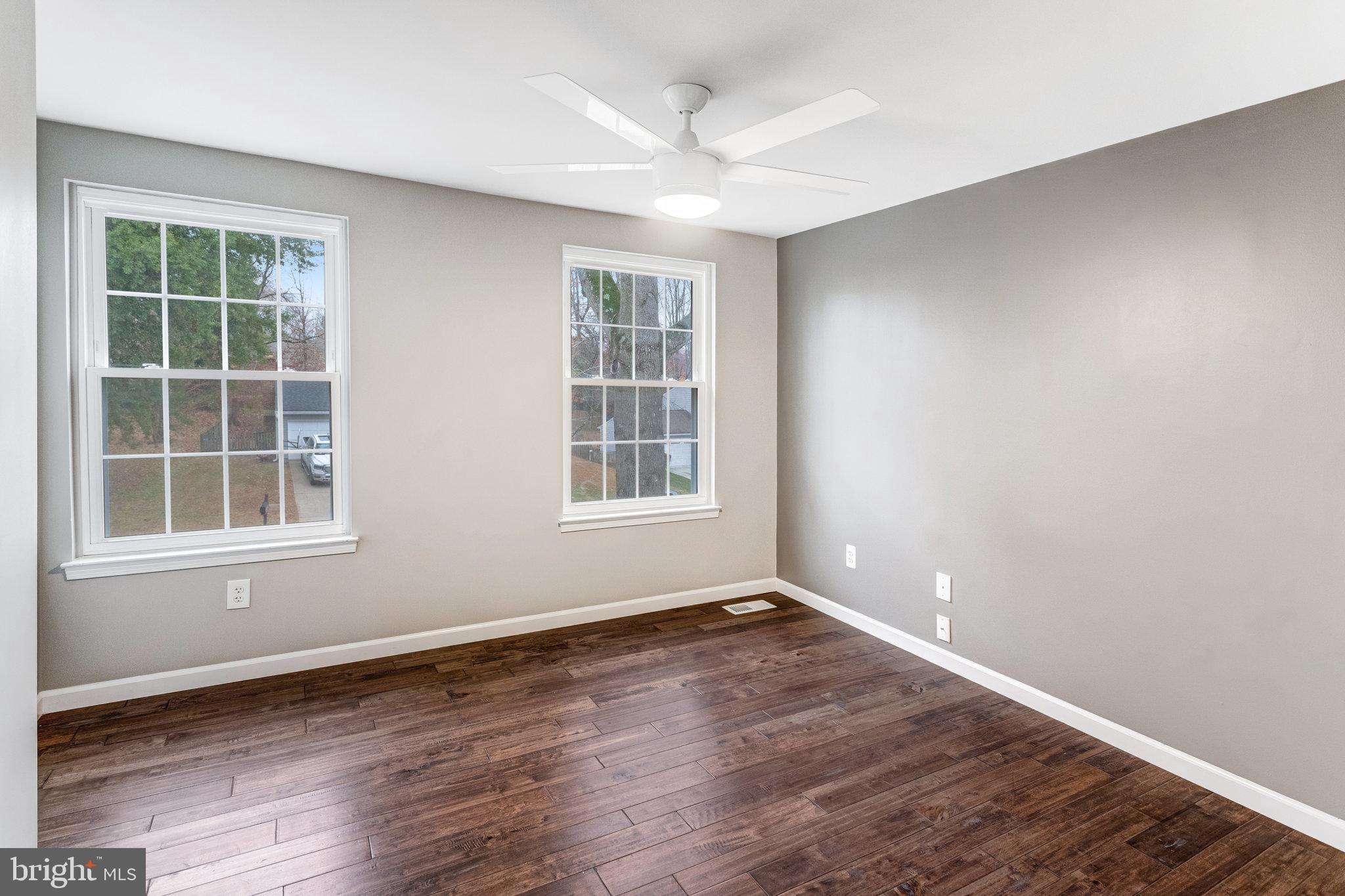 4586 Rincon Place Dumfries, VA 22025 - Photo 26 of 46 an empty room with wooden floor and windows