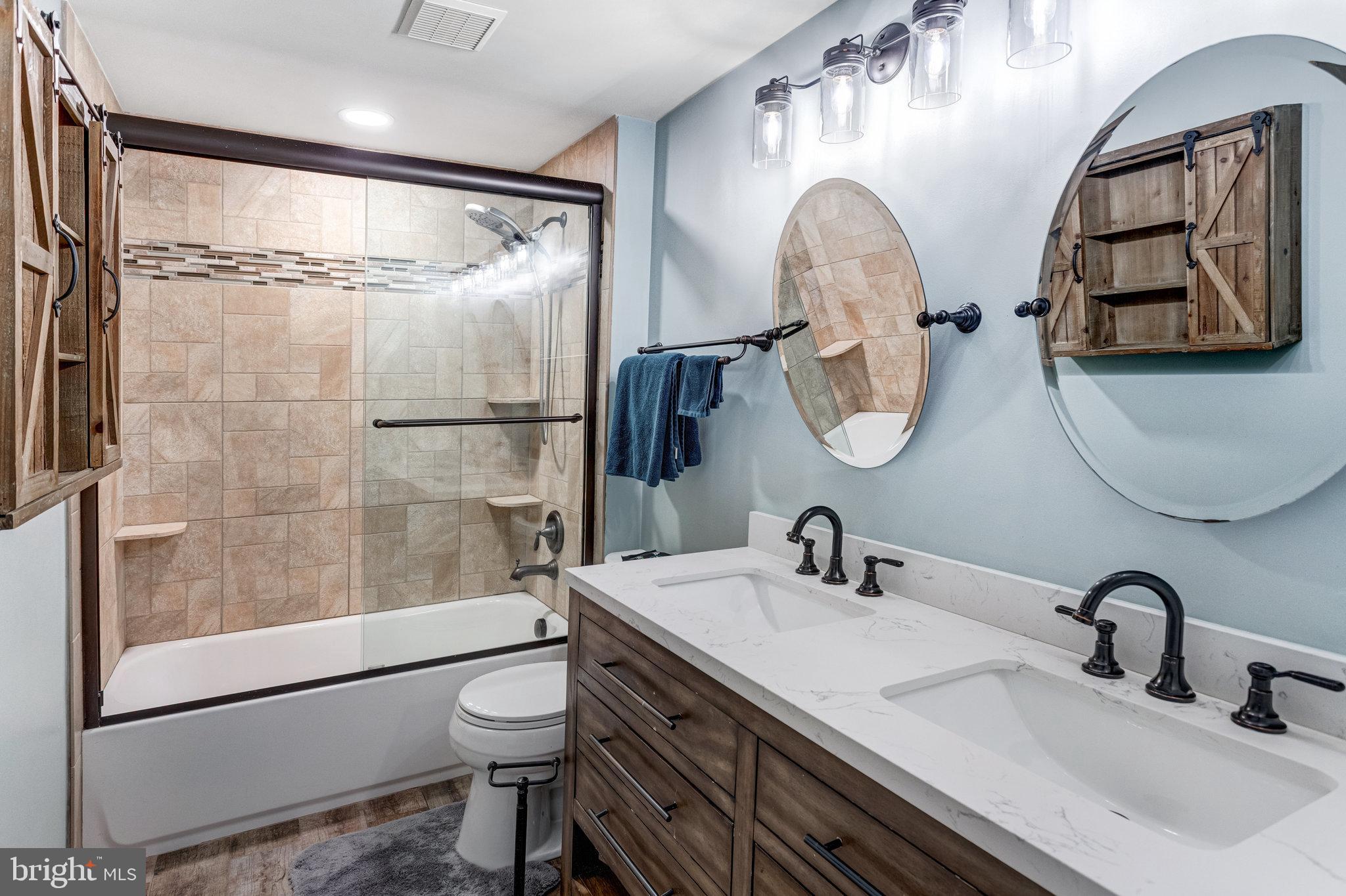 4586 Rincon Place Dumfries, VA 22025 - Photo 28 of 46 a bathroom with a sink a toilet and shower