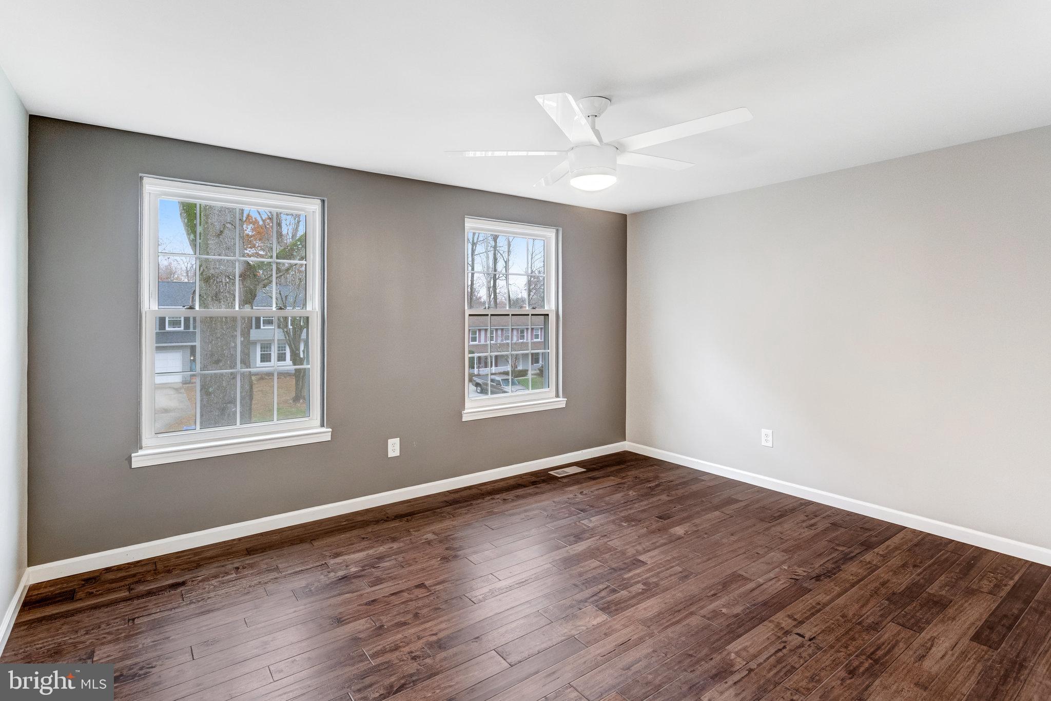 4586 Rincon Place Dumfries, VA 22025 - Photo 29 of 46 a view of an empty room with wooden floor and a window