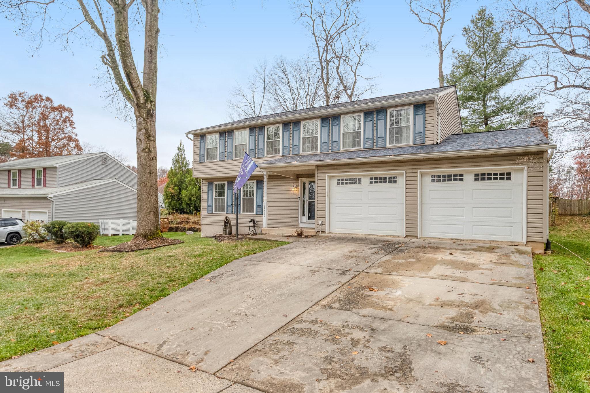 4586 Rincon Place Dumfries, VA 22025 - Photo 3 of 46 front view of a house with a yard