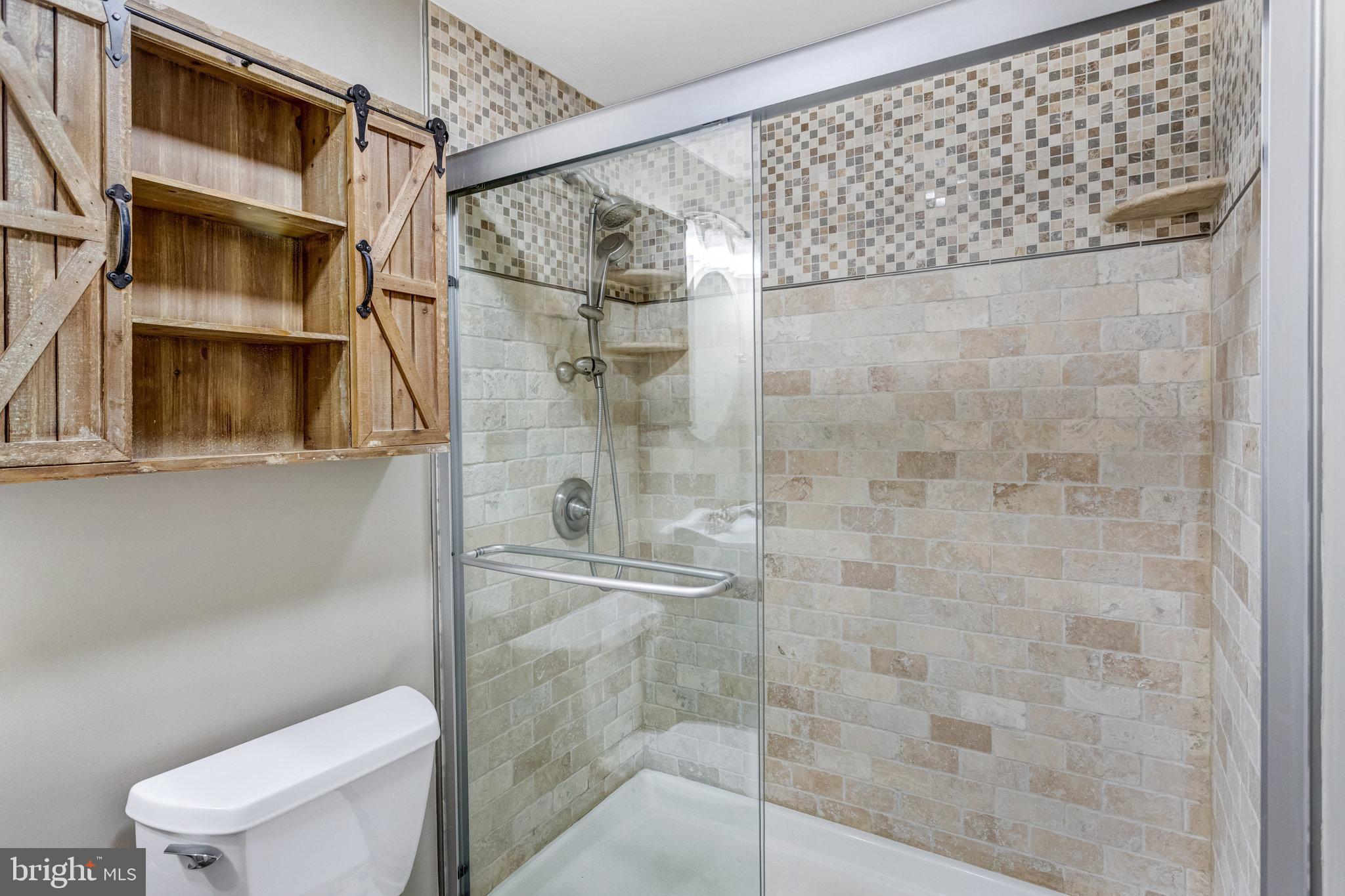 4586 Rincon Place Dumfries, VA 22025 - Photo 38 of 46 a bathroom with a shower and a toilet