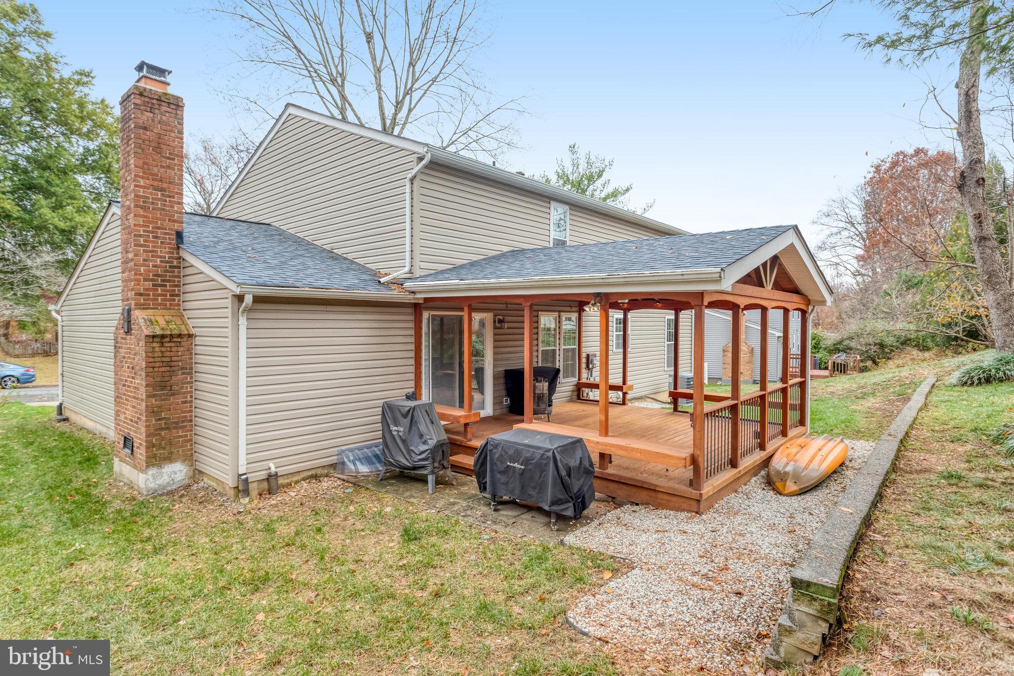 4586 Rincon Place Dumfries, VA 22025 - Photo 43 of 46 a front view of house with yard slide and seating space