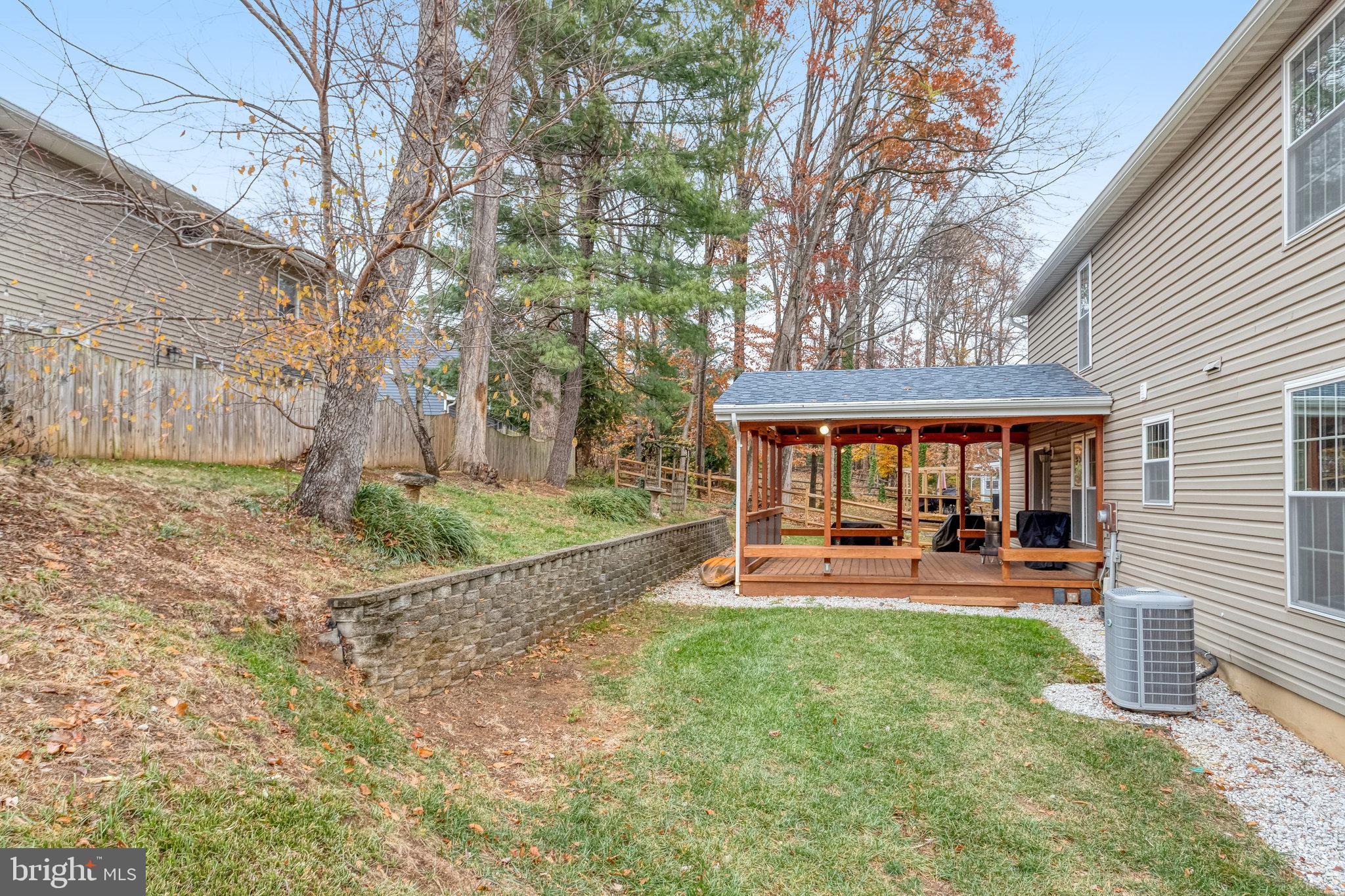 4586 Rincon Place Dumfries, VA 22025 - Photo 46 of 46 a view of a house with backyard porch and sitting area