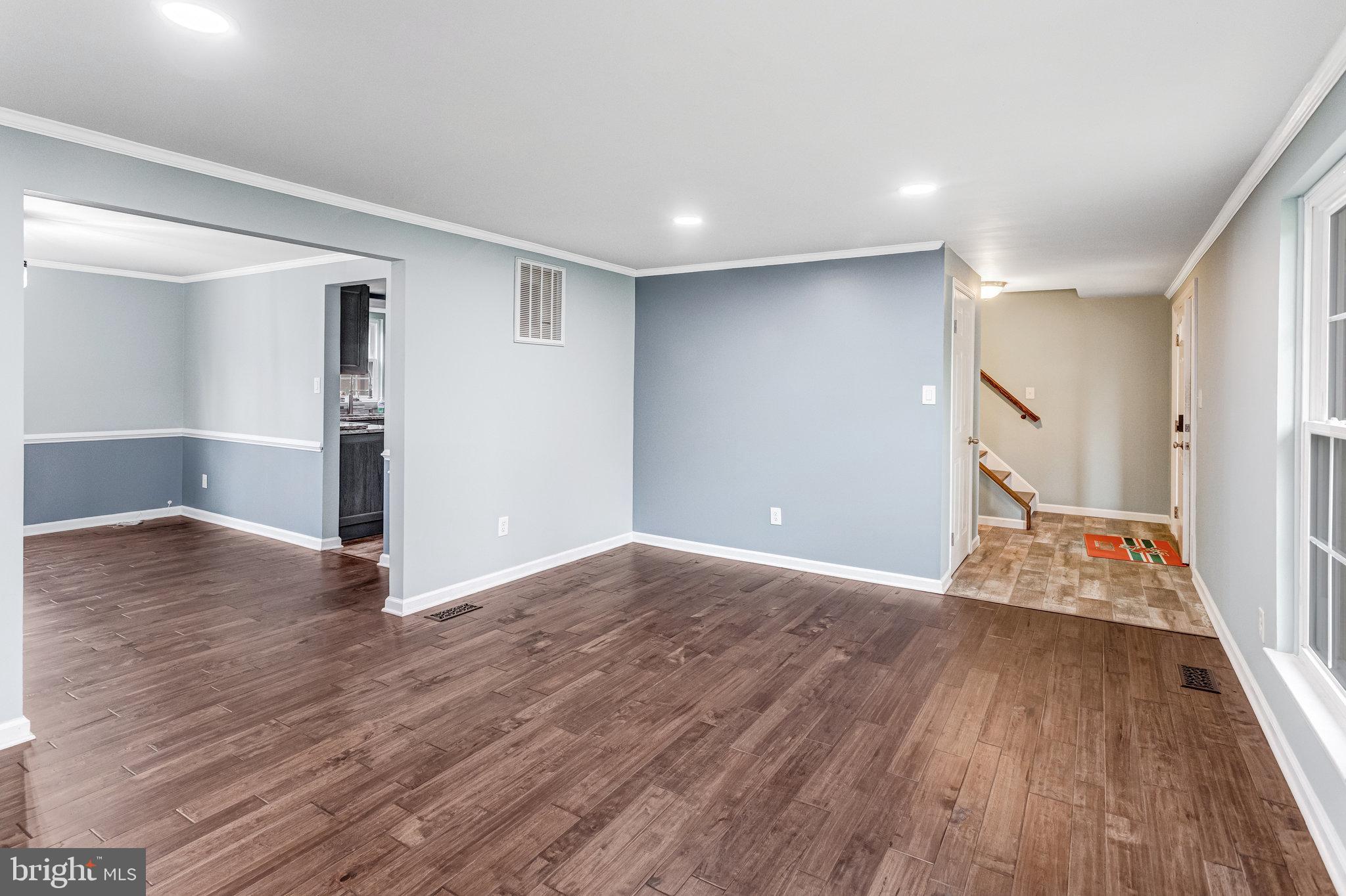 4586 Rincon Place Dumfries, VA 22025 - Photo 6 of 46 a view of livingroom with hardwood floor and hallway