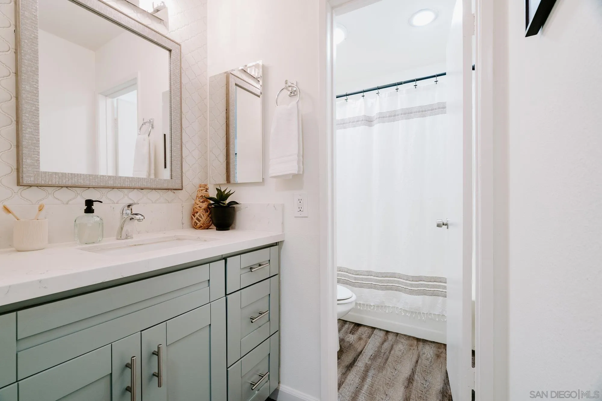 6780 Friars Road, Unit 346 San Diego, CA 92108 - Photo 19 of 29 a bathroom with a sink and a mirror
