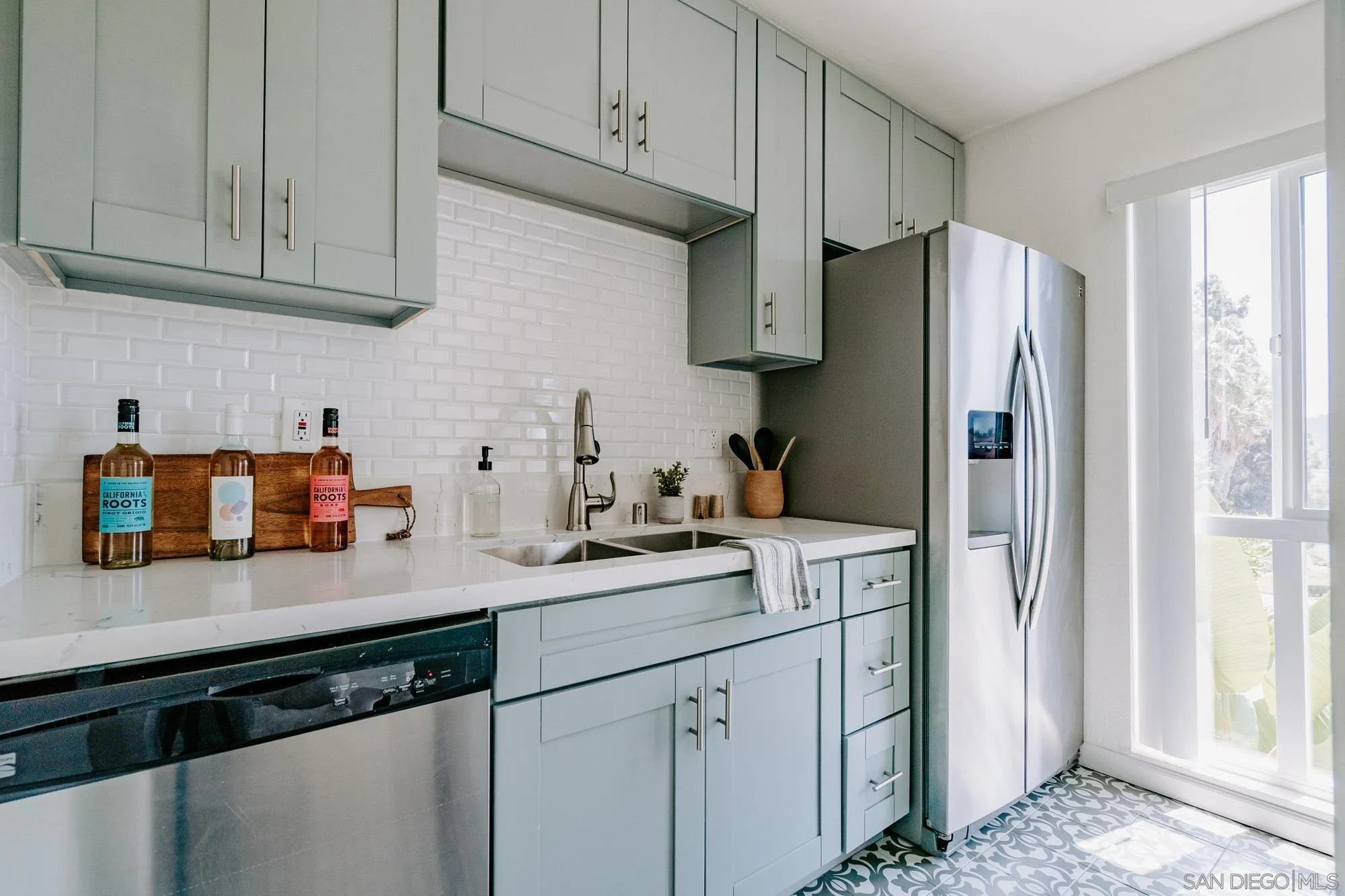 6780 Friars Road, Unit 346 San Diego, CA 92108 - Photo 5 of 29 a kitchen with stainless steel appliances granite countertop a refrigerator and a sink