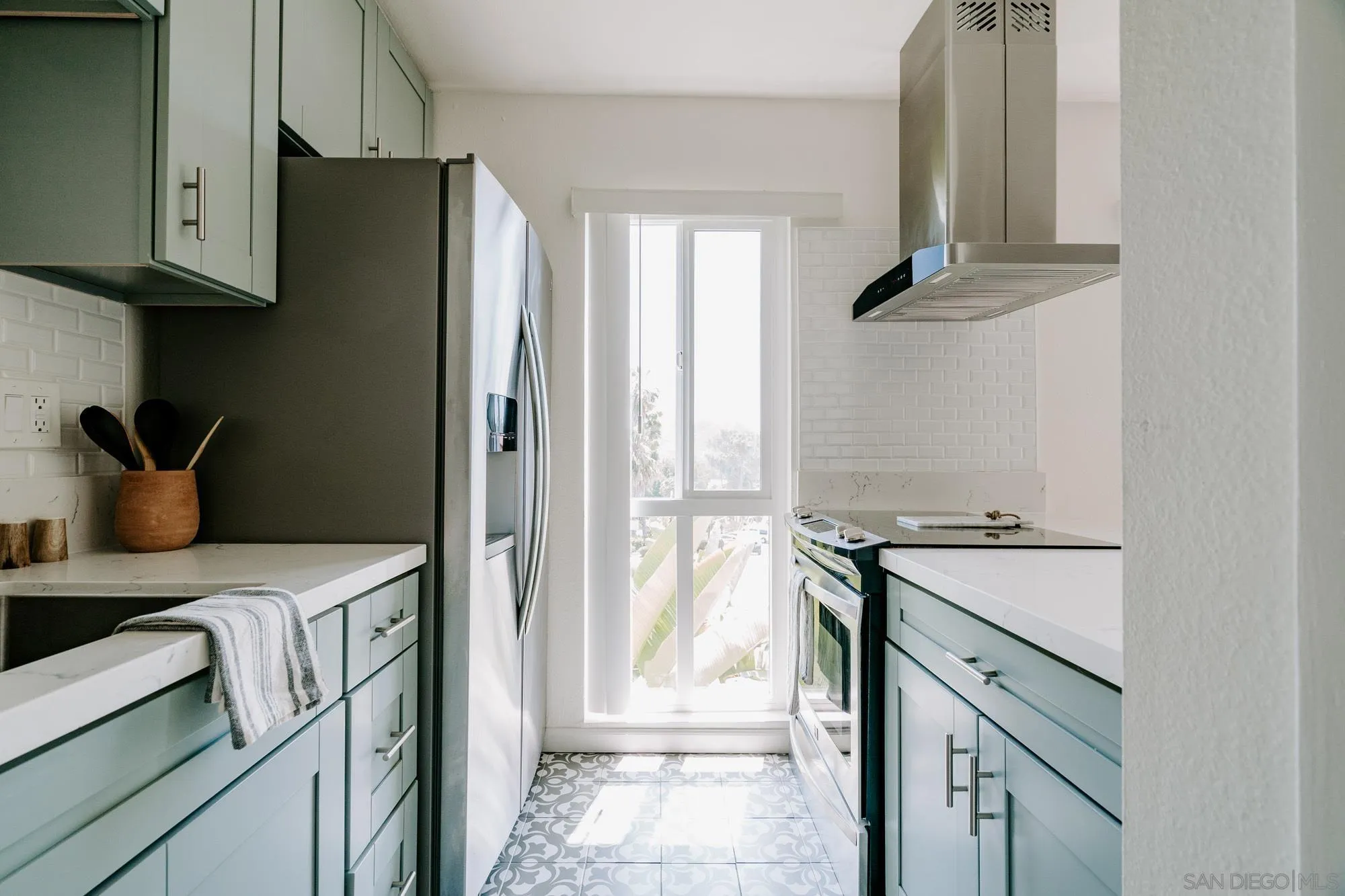 6780 Friars Road, Unit 346 San Diego, CA 92108 - Photo 6 of 29 a kitchen with stainless steel appliances granite countertop a refrigerator and a stove
