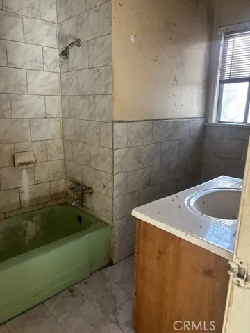 a bathroom with a sink and a bath tub