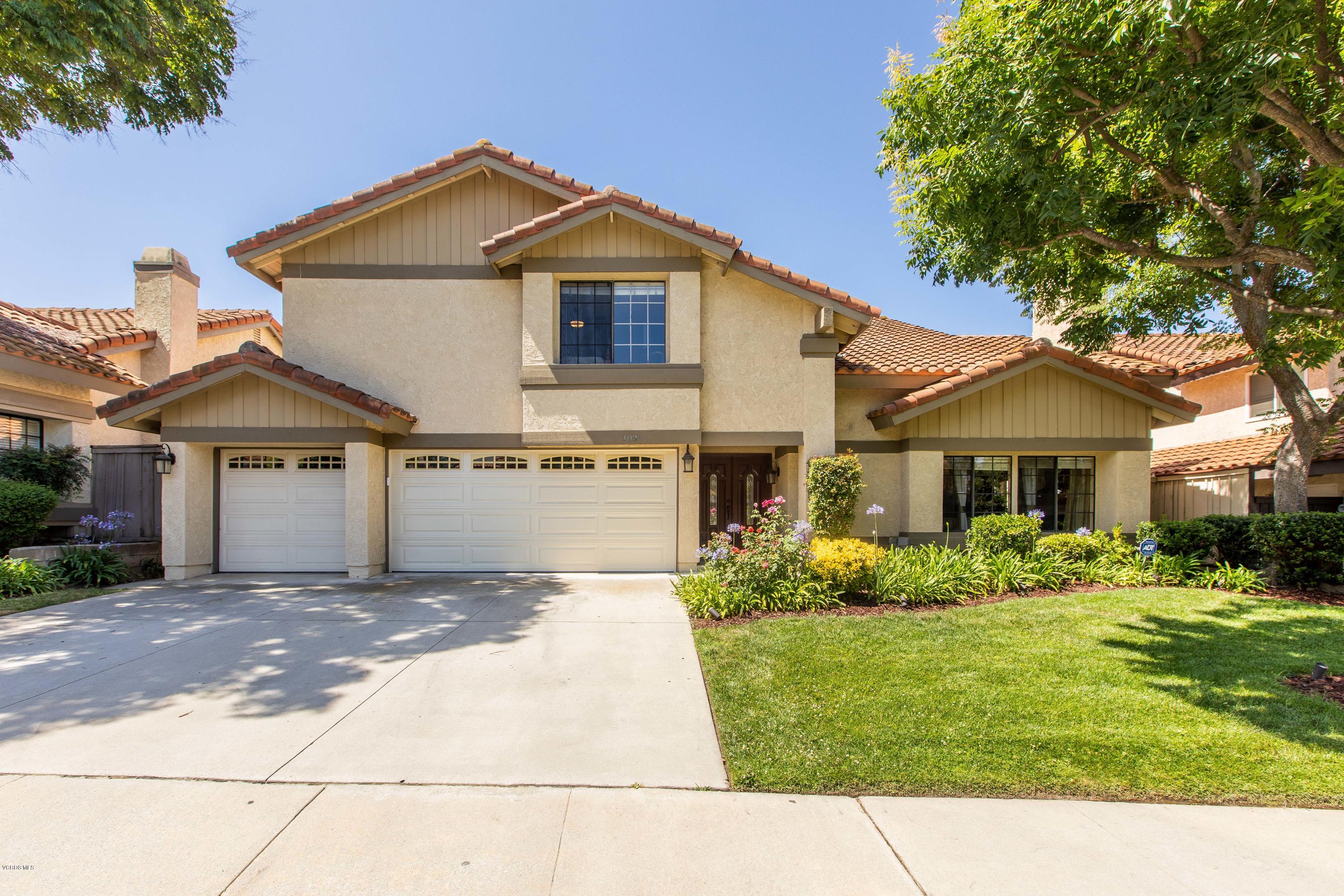 4034 Doneva Road Moorpark, CA 93021 - Photo 1 of 47 a front view of a house with a yard and garage