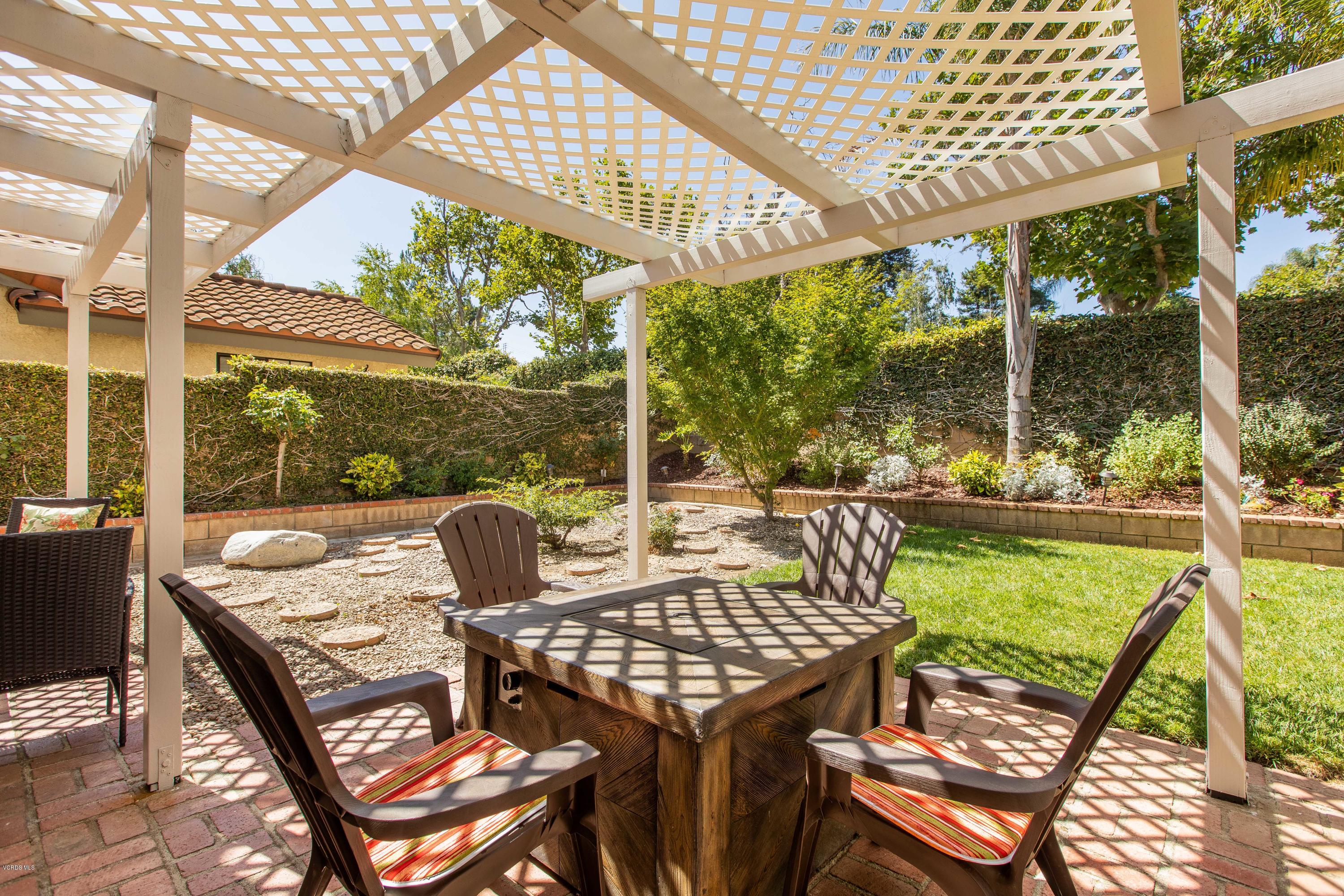 4034 Doneva Road Moorpark, CA 93021 - Photo 12 of 47 a view of a patio with a table chairs and balcony