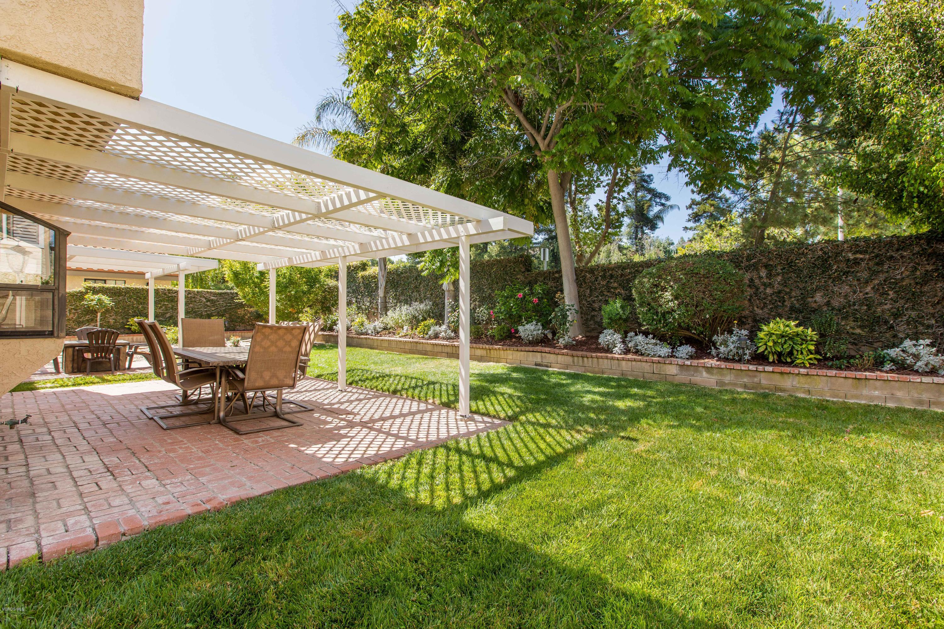 4034 Doneva Road Moorpark, CA 93021 - Photo 14 of 47 a garden view with a bench