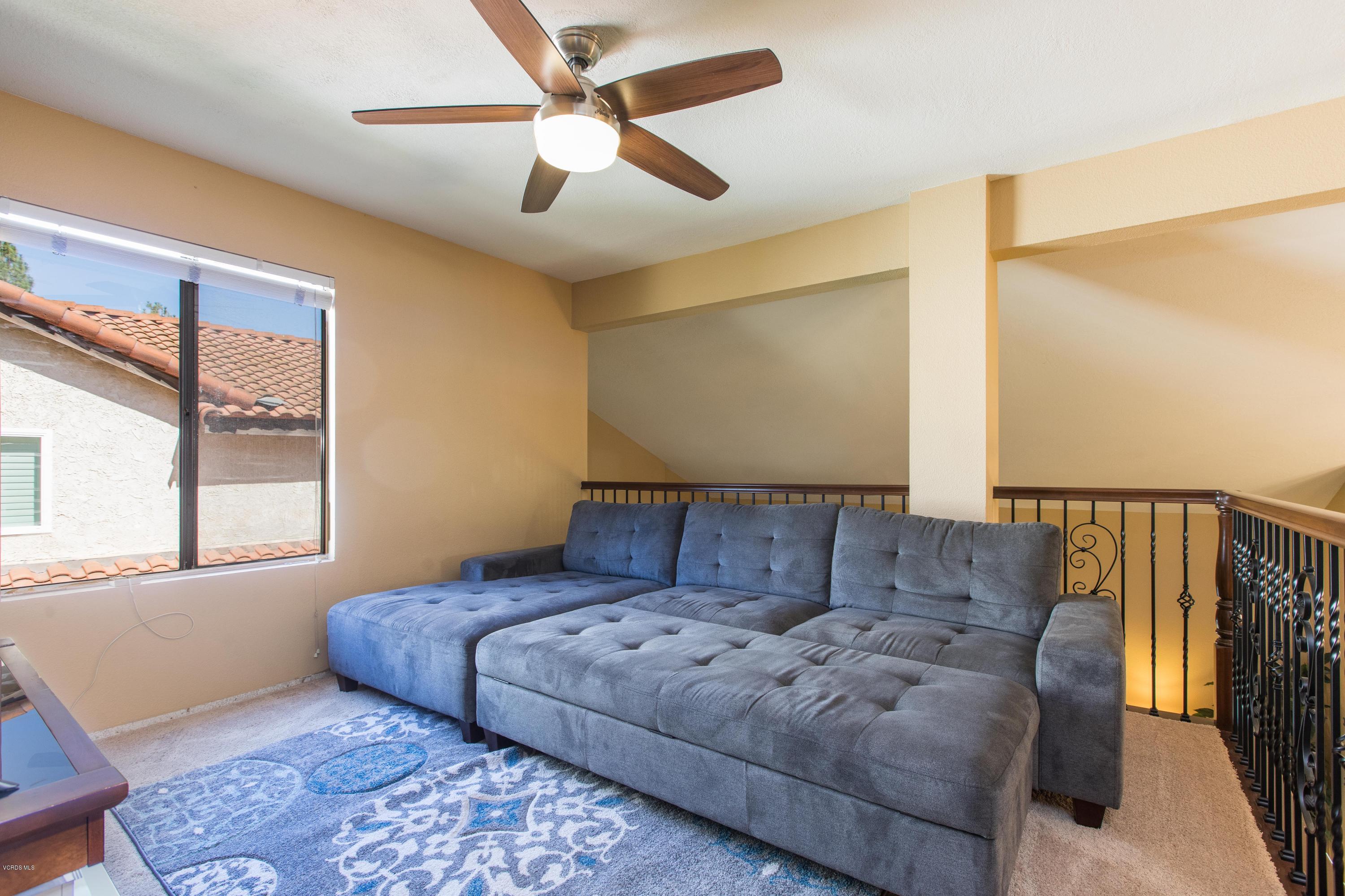 4034 Doneva Road Moorpark, CA 93021 - Photo 26 of 47 a living room with a couch and a window