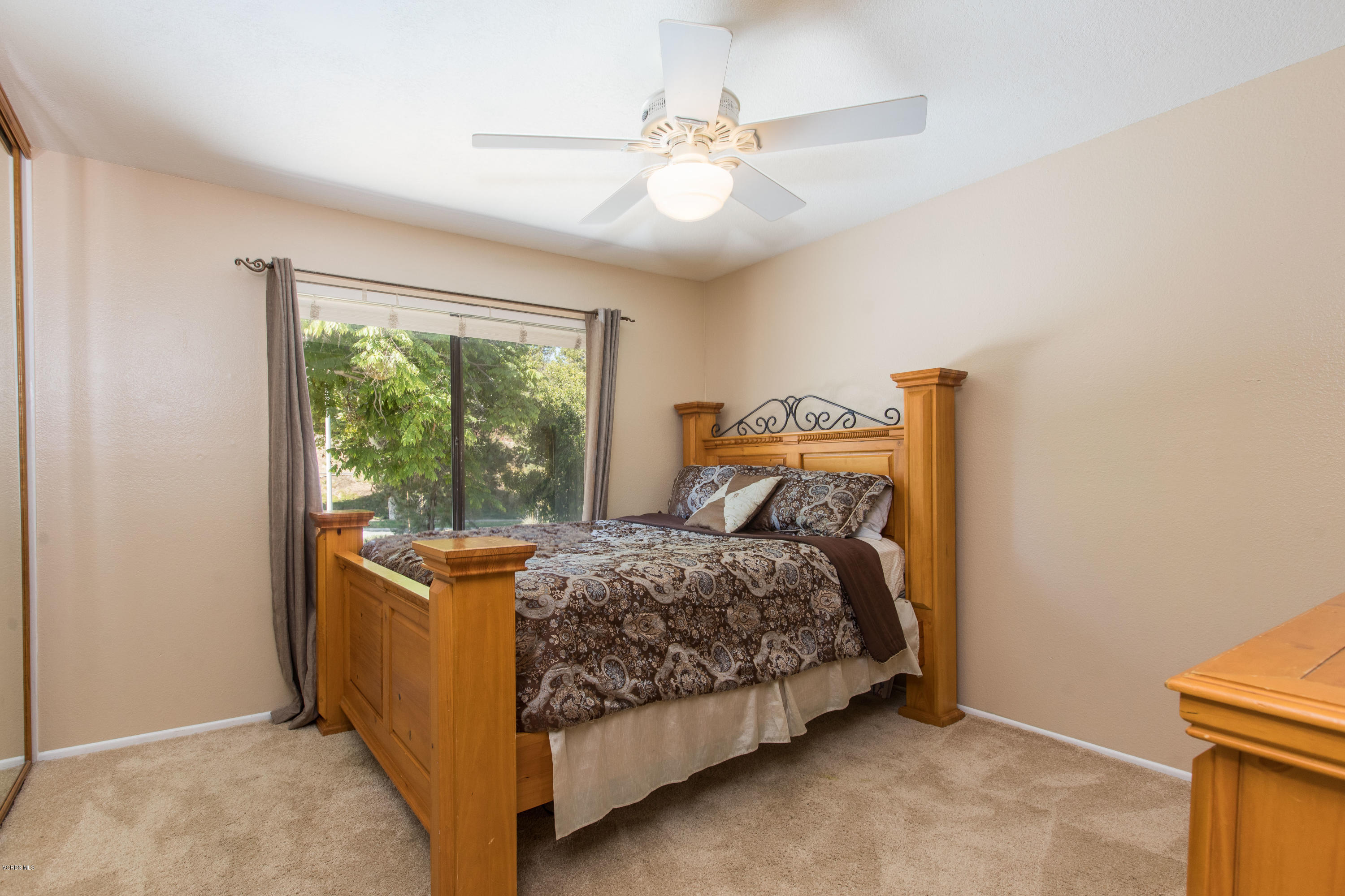 4034 Doneva Road Moorpark, CA 93021 - Photo 29 of 47 a bed sitting in a bedroom next to a window