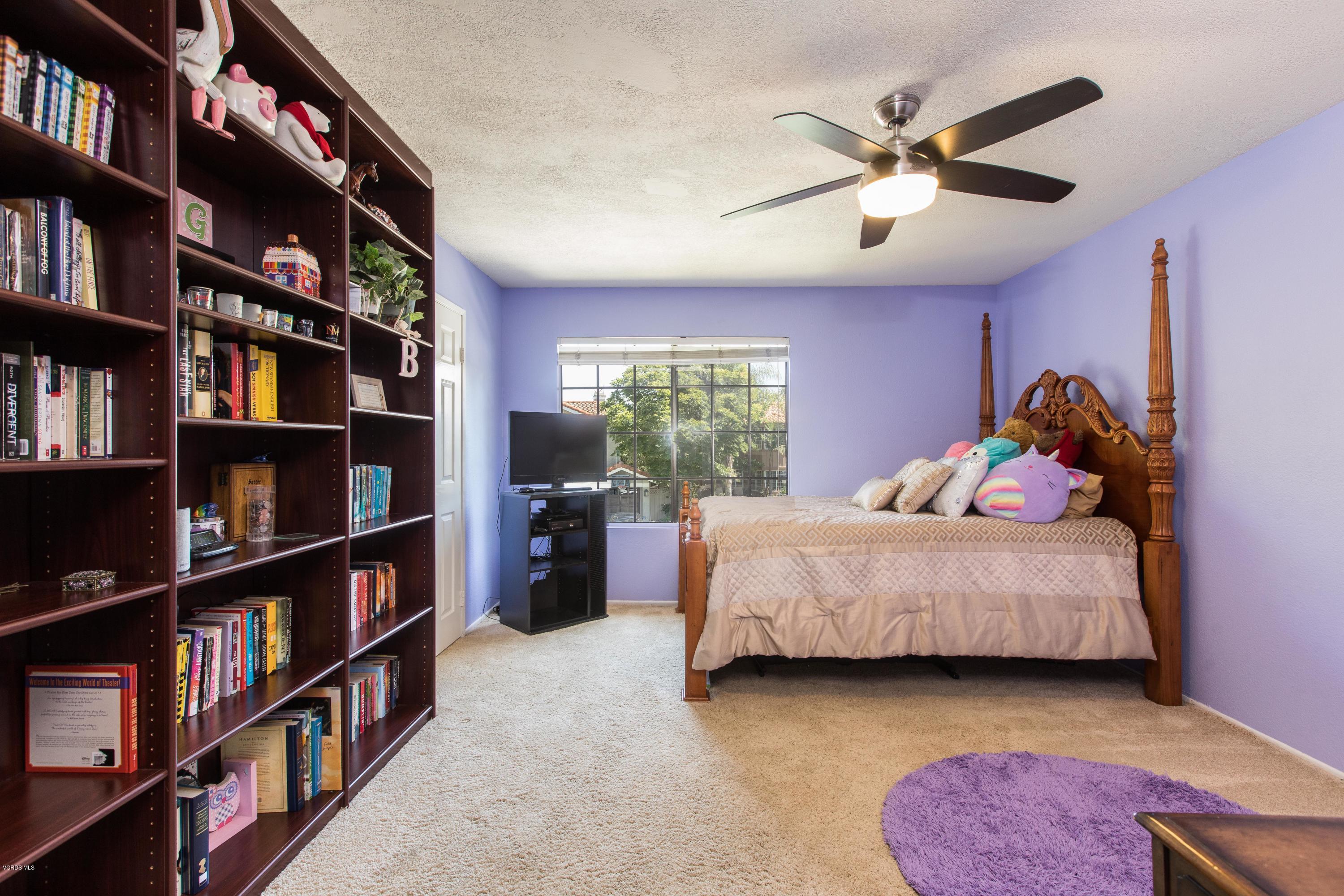 4034 Doneva Road Moorpark, CA 93021 - Photo 31 of 47 a bedroom with a bed a book shelf and a window