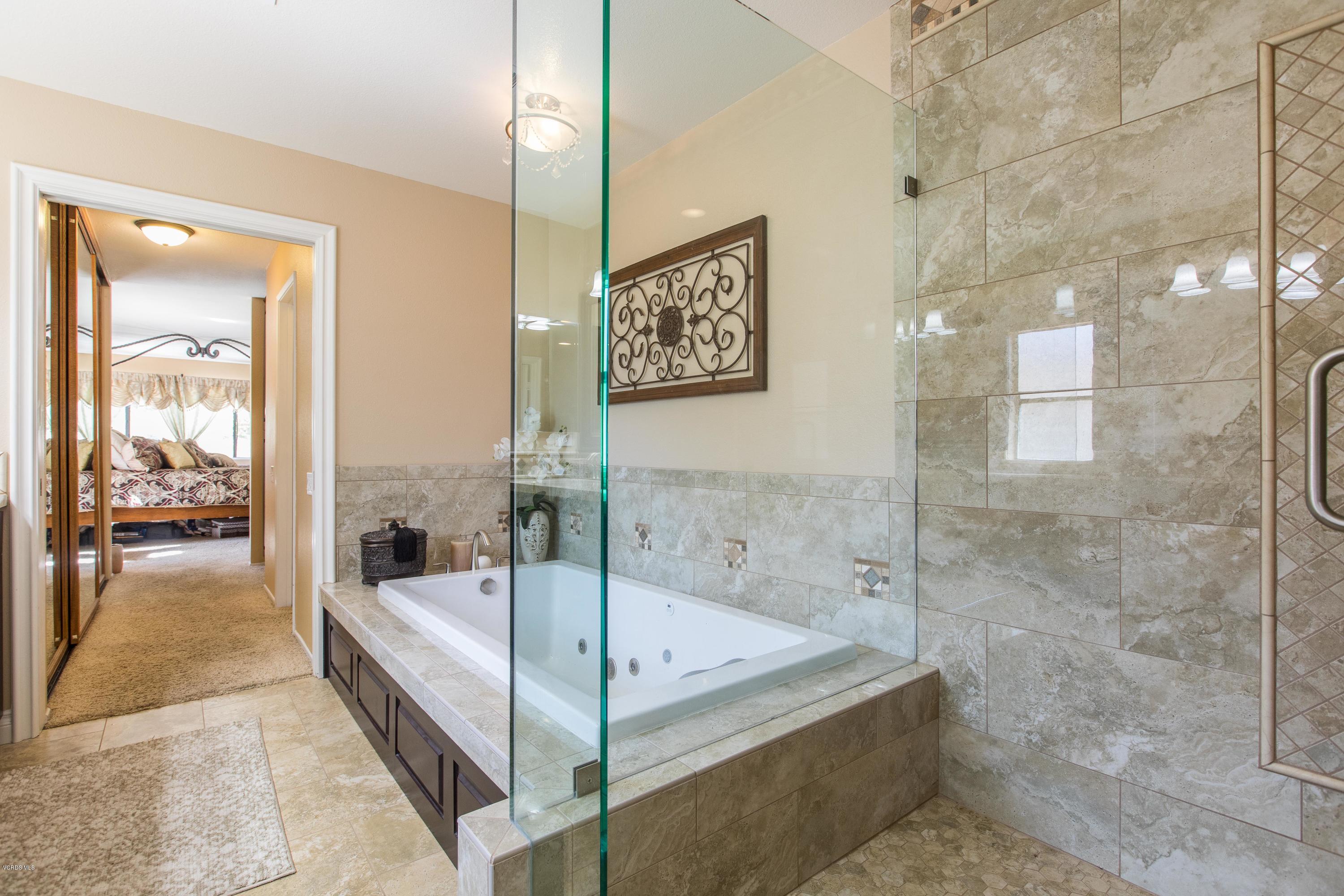 4034 Doneva Road Moorpark, CA 93021 - Photo 6 of 47 a bathroom with a tub and shower