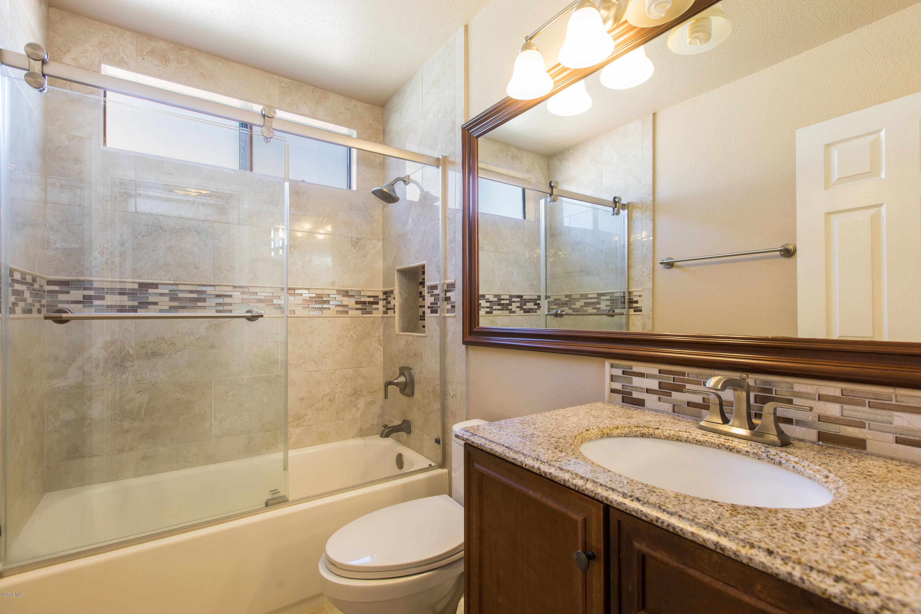 4034 Doneva Road Moorpark, CA 93021 - Photo 8 of 47 a bathroom with a granite countertop sink toilet and shower