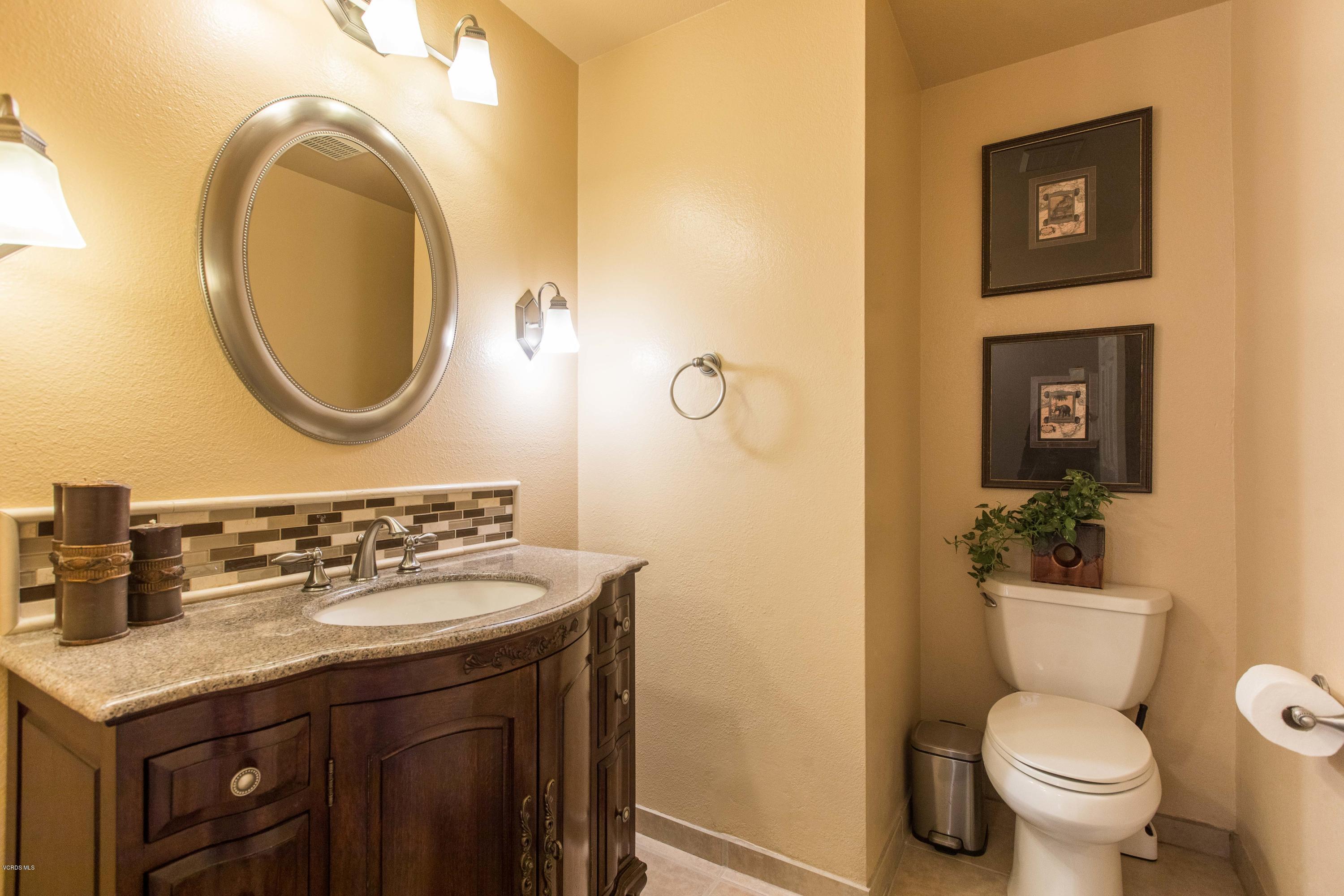 4034 Doneva Road Moorpark, CA 93021 - Photo 10 of 47 a bathroom with a toilet a sink and a mirror