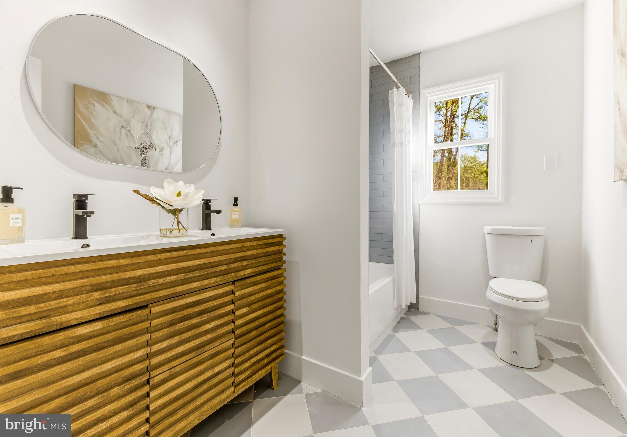 2470 Medford Road Atco, NJ 08004 - Photo 16 of 22 a bathroom with a sink a toilet and mirror