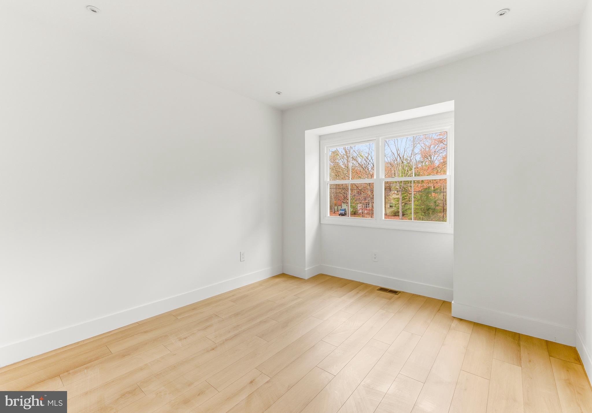 2470 Medford Road Atco, NJ 08004 - Photo 18 of 22 an empty room with wooden floor and windows