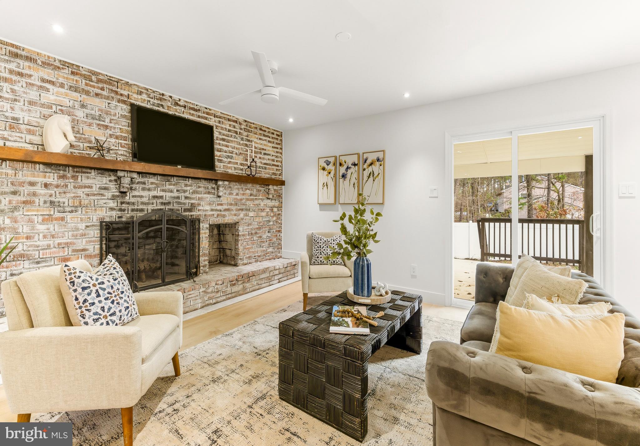 2470 Medford Road Atco, NJ 08004 - Photo 5 of 22 a living room with furniture flat screen tv and a fireplace