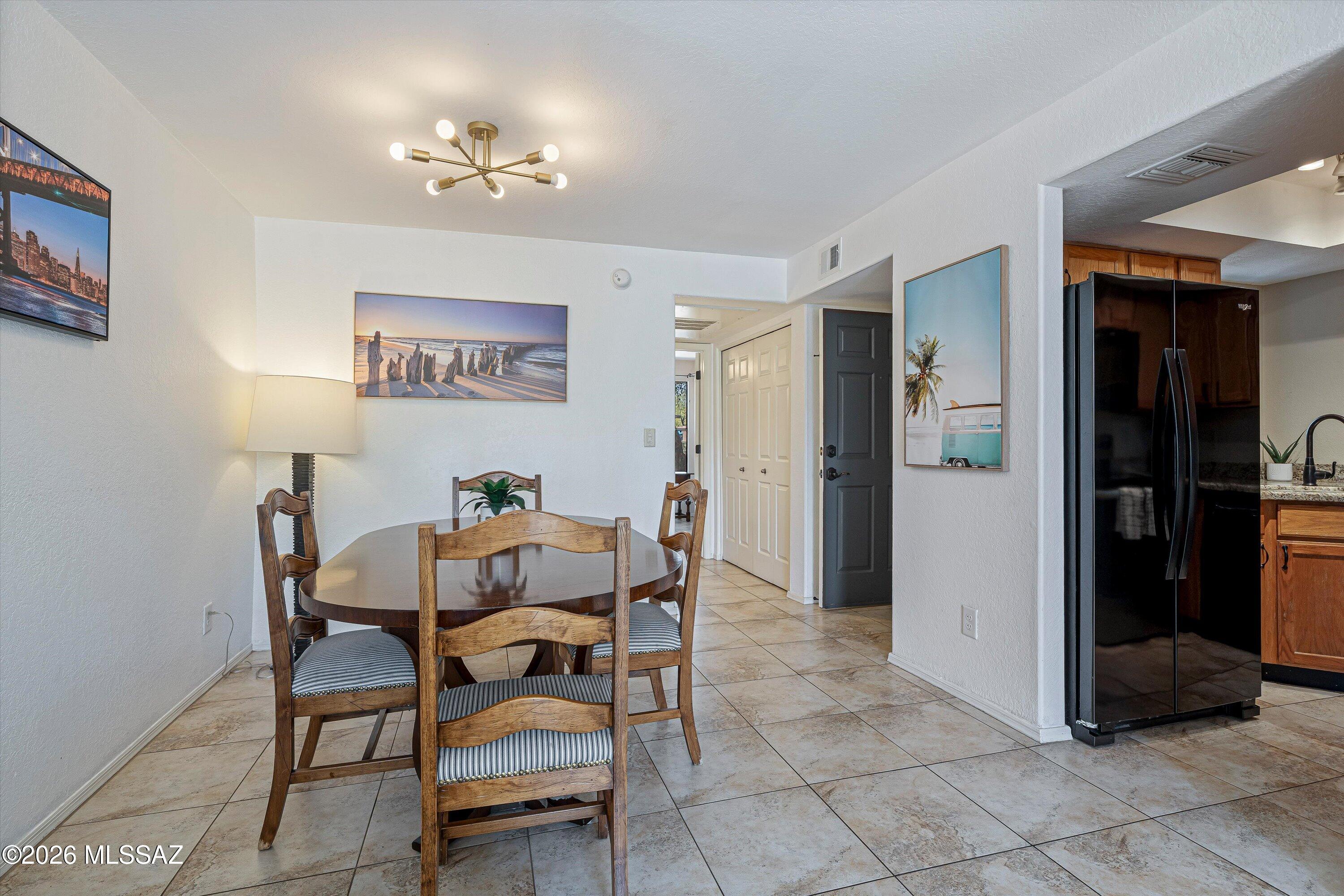 5800 North Kolb Road, Unit 5125 Tucson, AZ 85750 - Photo 7 of 34 a view of a dining room with furniture