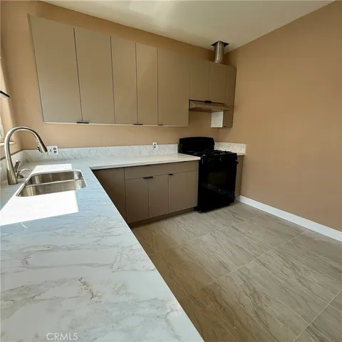 a kitchen with a sink and cabinets