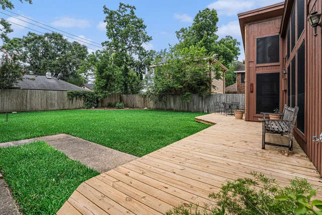 a view of a backyard with sitting area