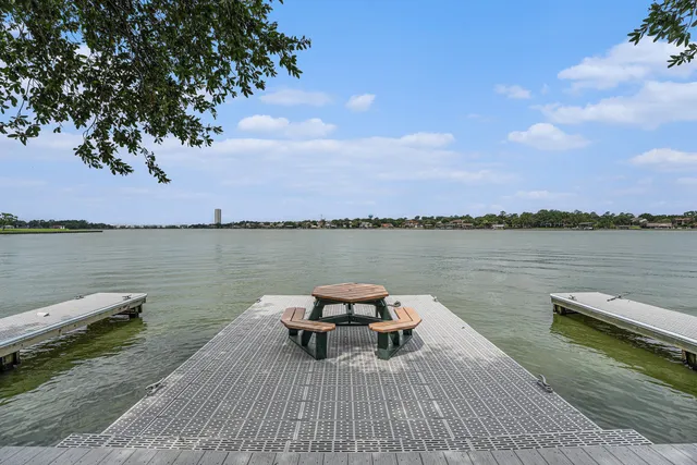a view of a lake with sitting area