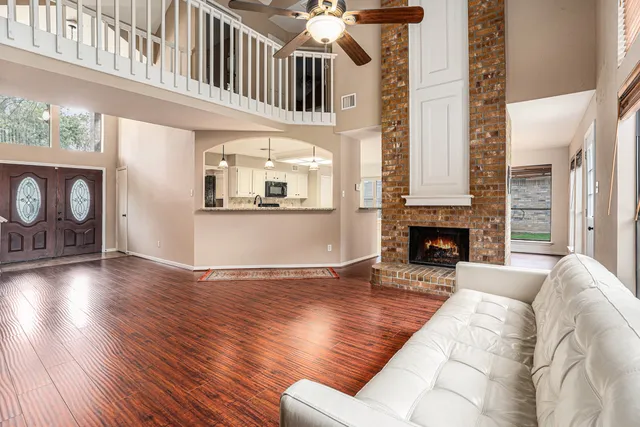 a living room with furniture and a fireplace