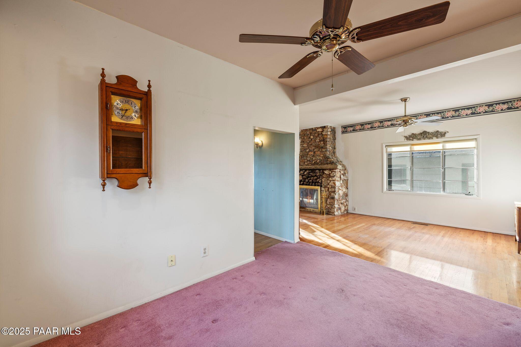 224 Congress Avenue Prescott, AZ 86303 - Photo 16 of 59 a view of a livingroom with a chandelier fan and windows
