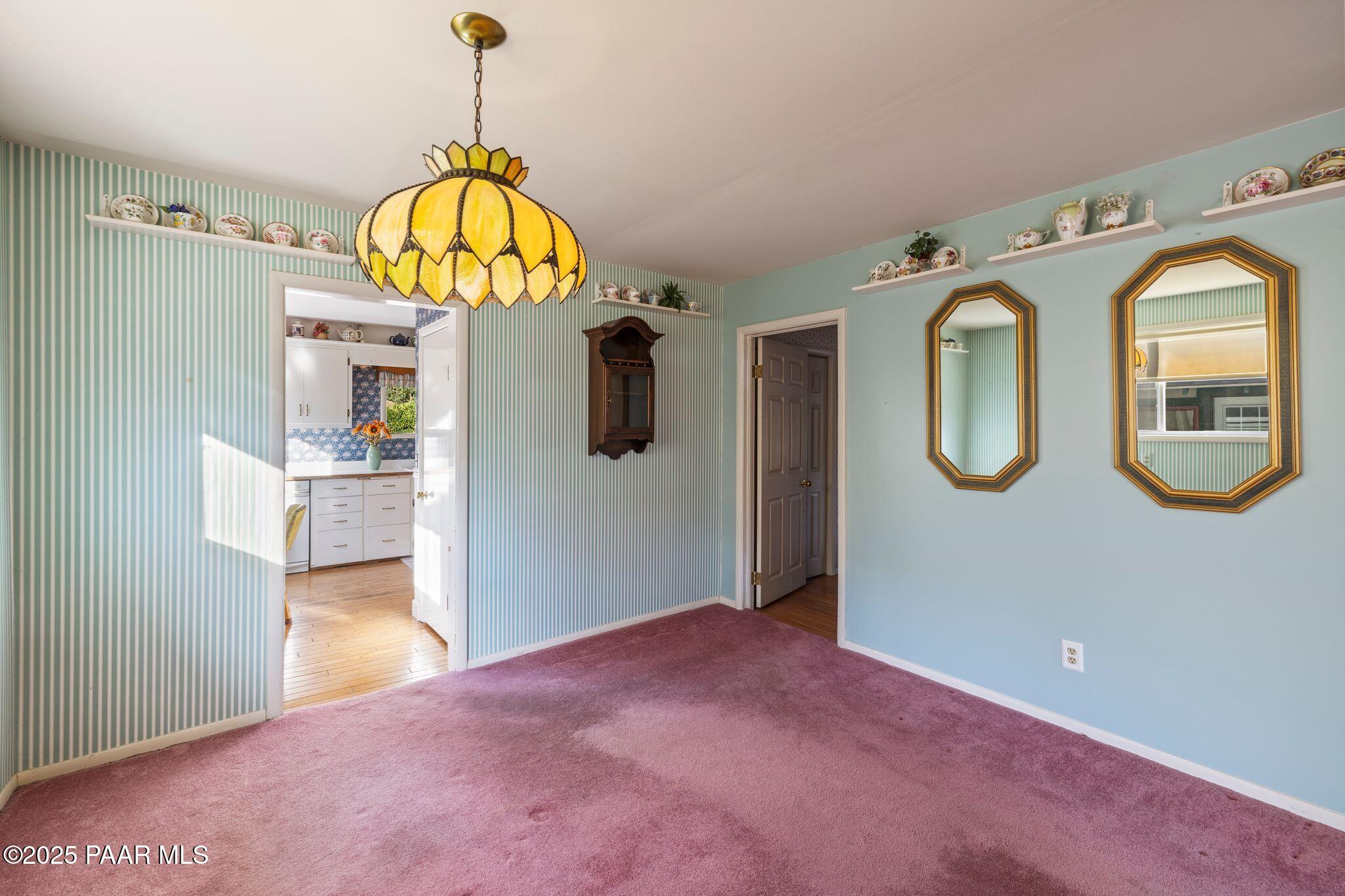 224 Congress Avenue Prescott, AZ 86303 - Photo 19 of 59 a view of a hallway with wooden floor and a chandelier