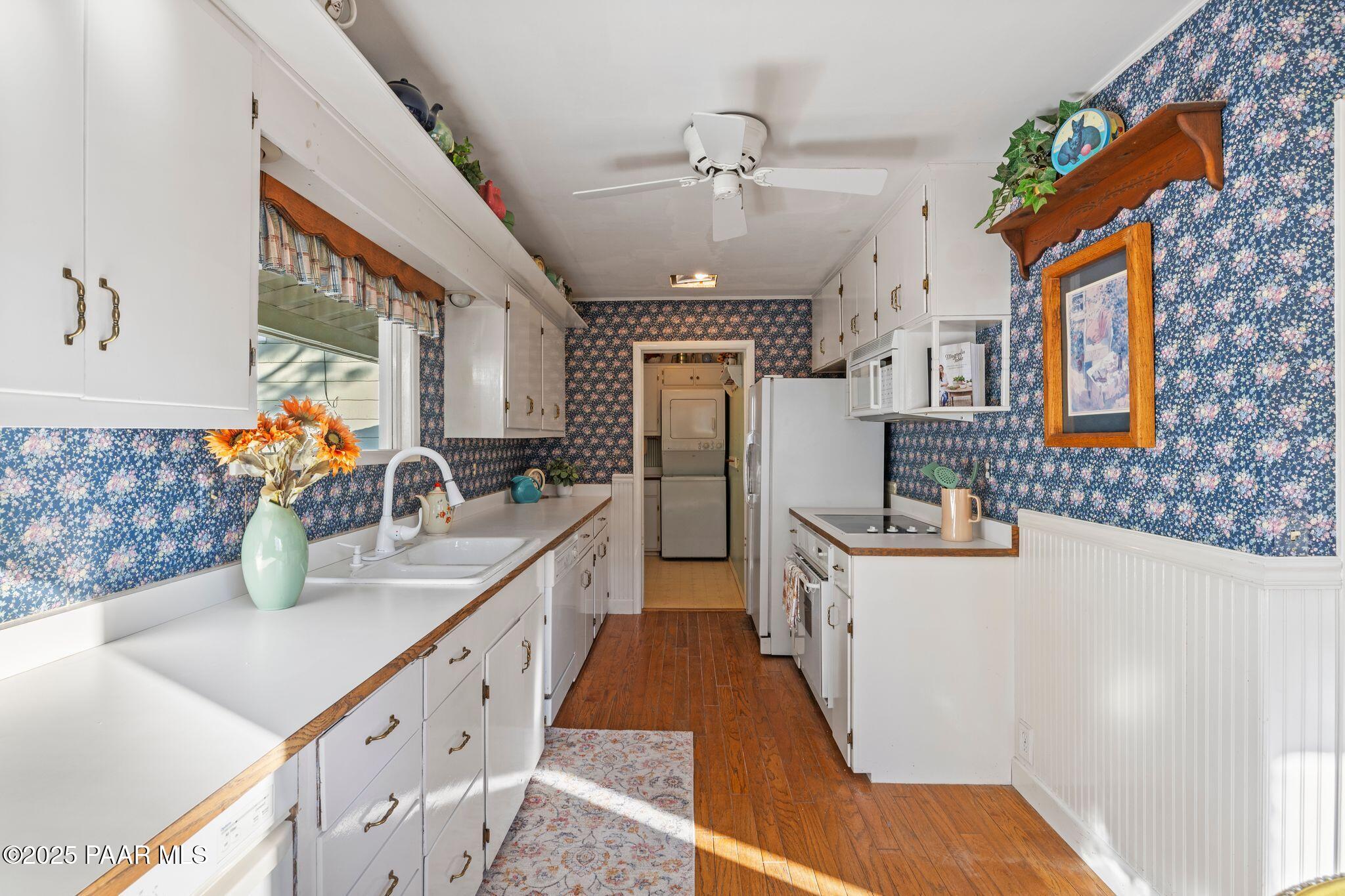 224 Congress Avenue Prescott, AZ 86303 - Photo 22 of 59 a kitchen with stainless steel appliances granite countertop a sink stove and refrigerator