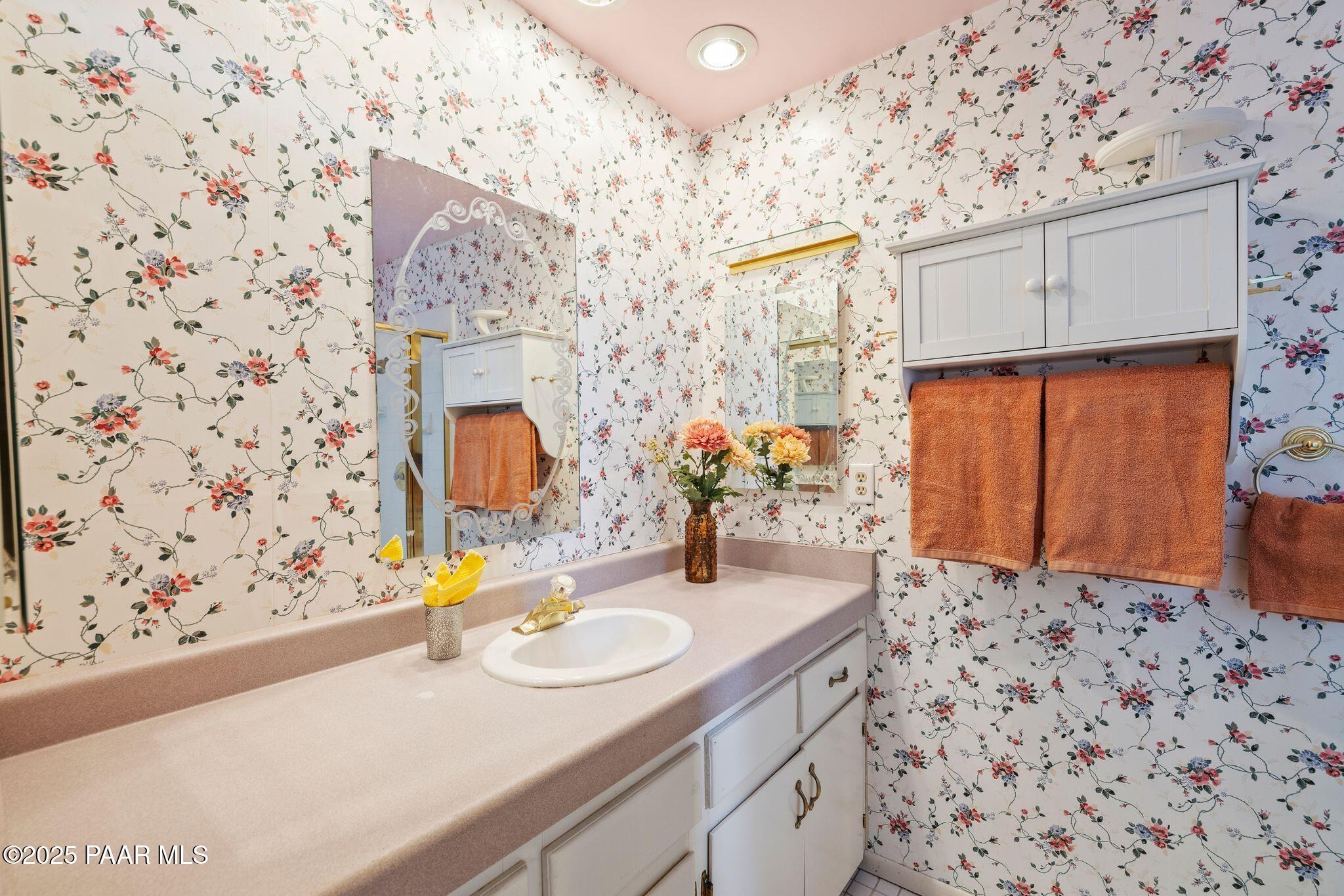 224 Congress Avenue Prescott, AZ 86303 - Photo 30 of 59 a bathroom with a sink and a mirror