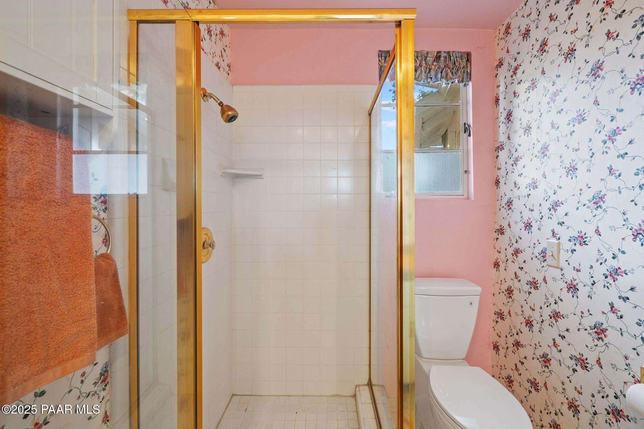 224 Congress Avenue Prescott, AZ 86303 - Photo 31 of 59 a white toilet sitting next to a bathroom sink