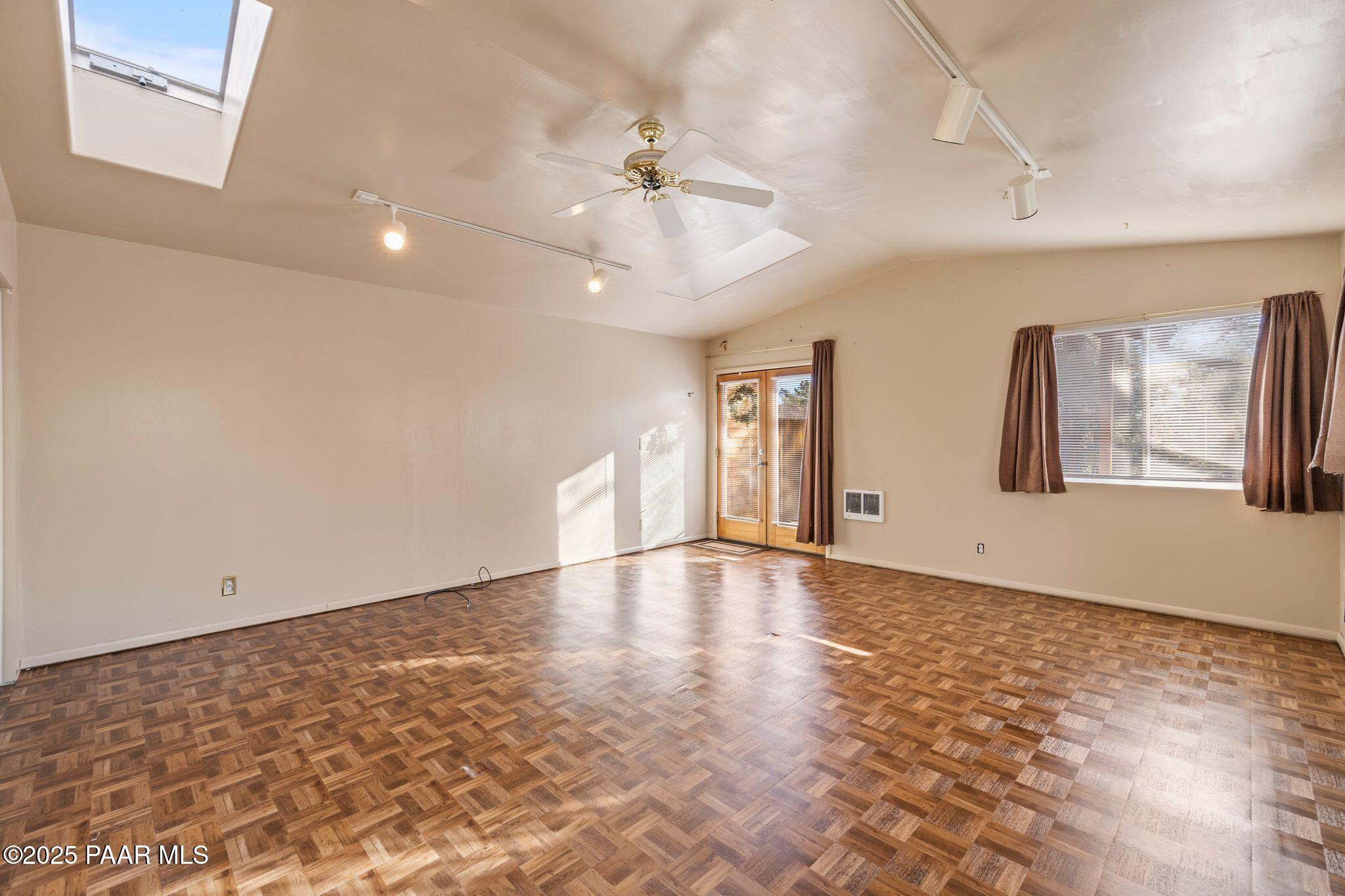 224 Congress Avenue Prescott, AZ 86303 - Photo 40 of 59 a view of an empty room with window and wooden floor