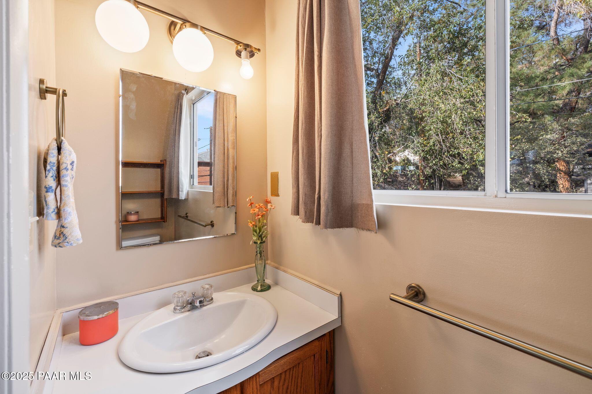 224 Congress Avenue Prescott, AZ 86303 - Photo 41 of 59 a bathroom with a sink and a mirror