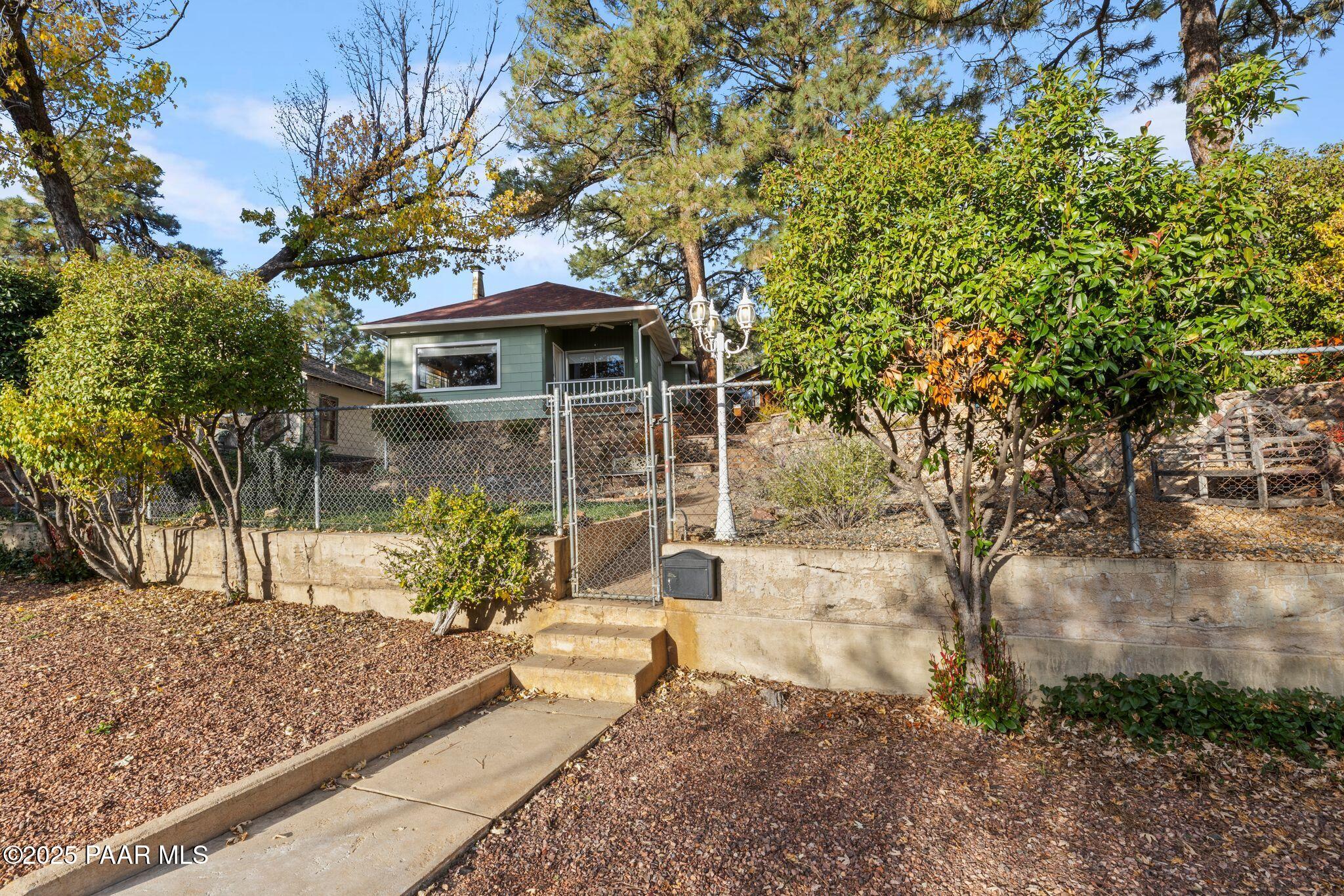 224 Congress Avenue Prescott, AZ 86303 - Photo 6 of 59 a front view of a house with garden