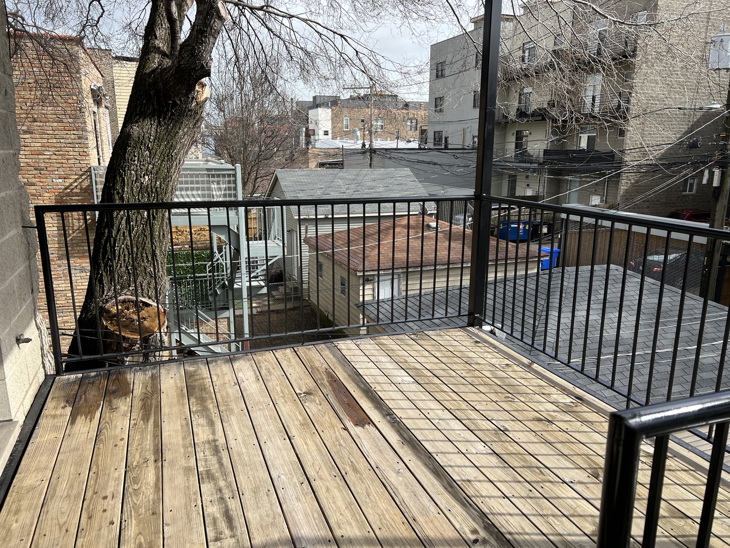 2649 West Rice Street Chicago, IL 60622 - Photo 6 of 14 a view of balcony with wooden floor and fence
