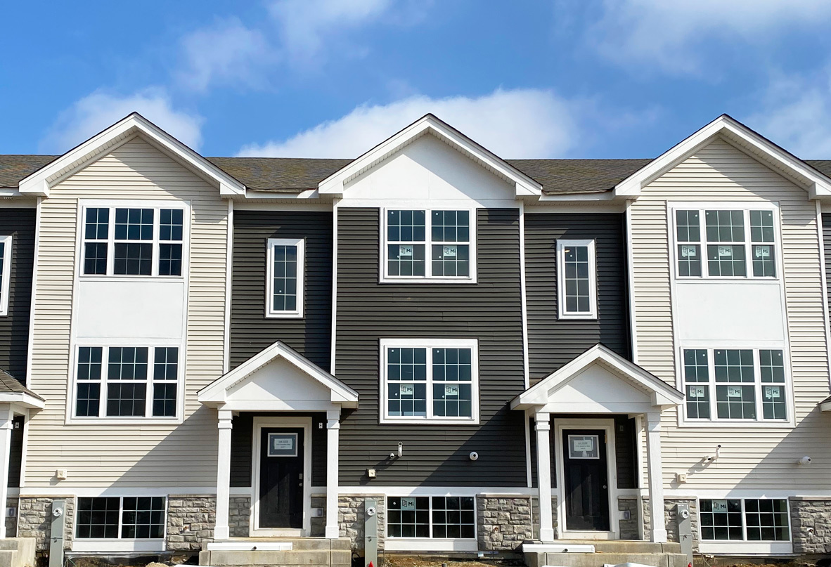 a front view of a house with a yard