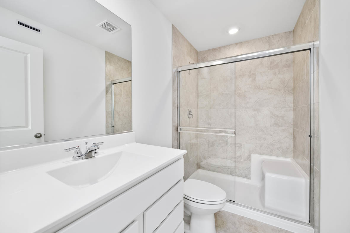 2121 Sassafras Way, Unit C Wonder Lake, IL 60097 - Photo 11 of 57 a bathroom with a sink toilet and shower