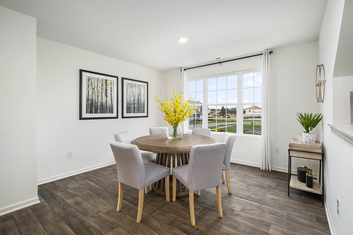 2121 Sassafras Way, Unit C Wonder Lake, IL 60097 - Photo 15 of 57 a view of a dining room with furniture window and wooden floor