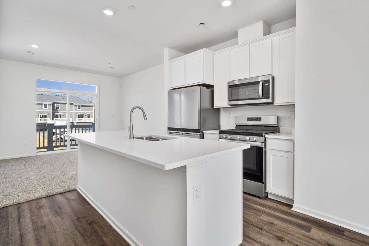 2121 Sassafras Way, Unit C Wonder Lake, IL 60097 - Photo 4 of 57 a kitchen with stainless steel appliances a sink stove and refrigerator