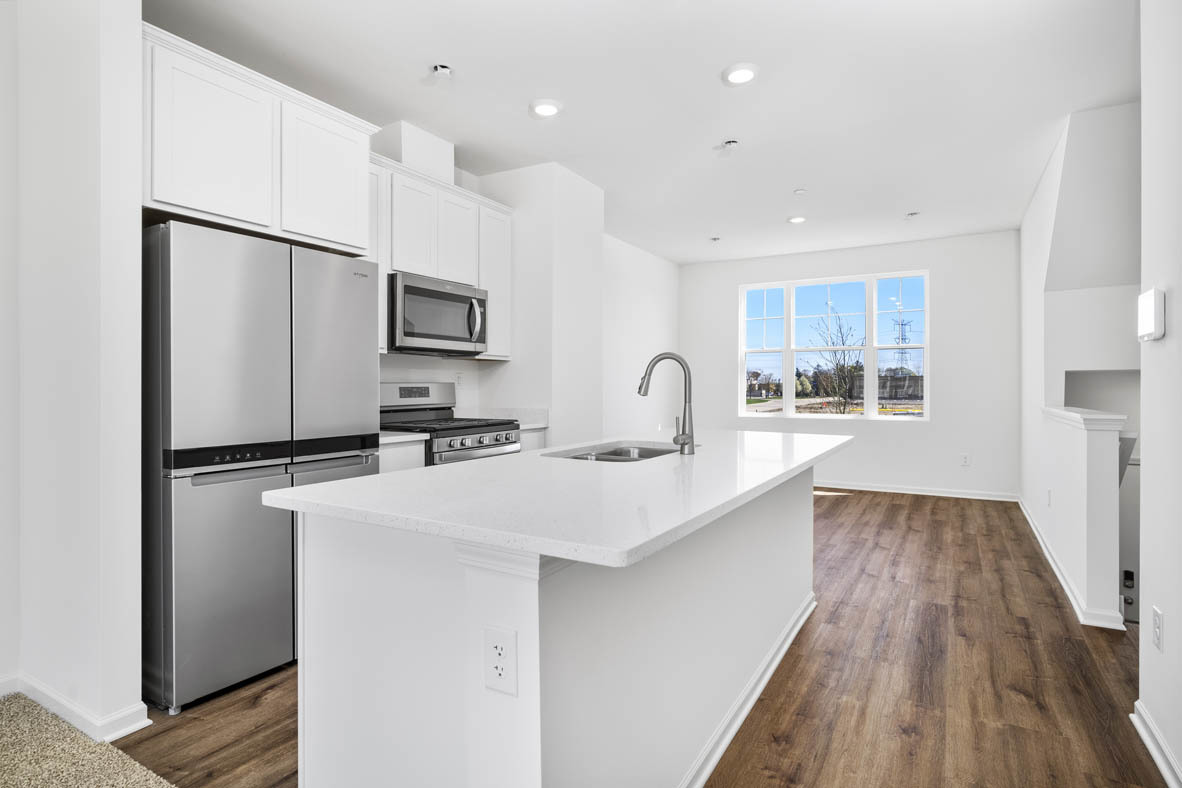 2121 Sassafras Way, Unit C Wonder Lake, IL 60097 - Photo 8 of 57 a kitchen with kitchen island a sink appliances and cabinets