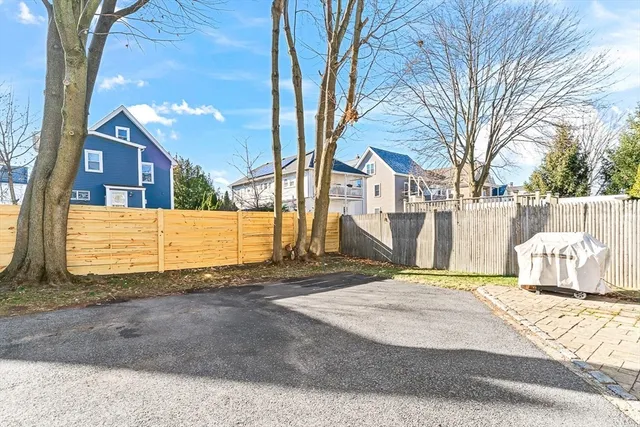 a view of a house with a snow in the yard
