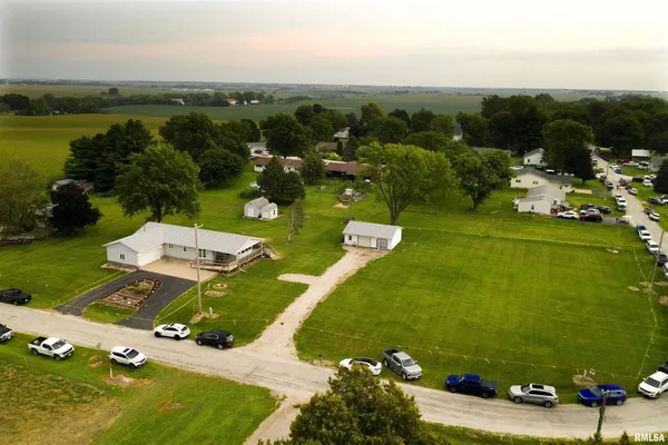 an aerial view of a residential houses with outdoor space